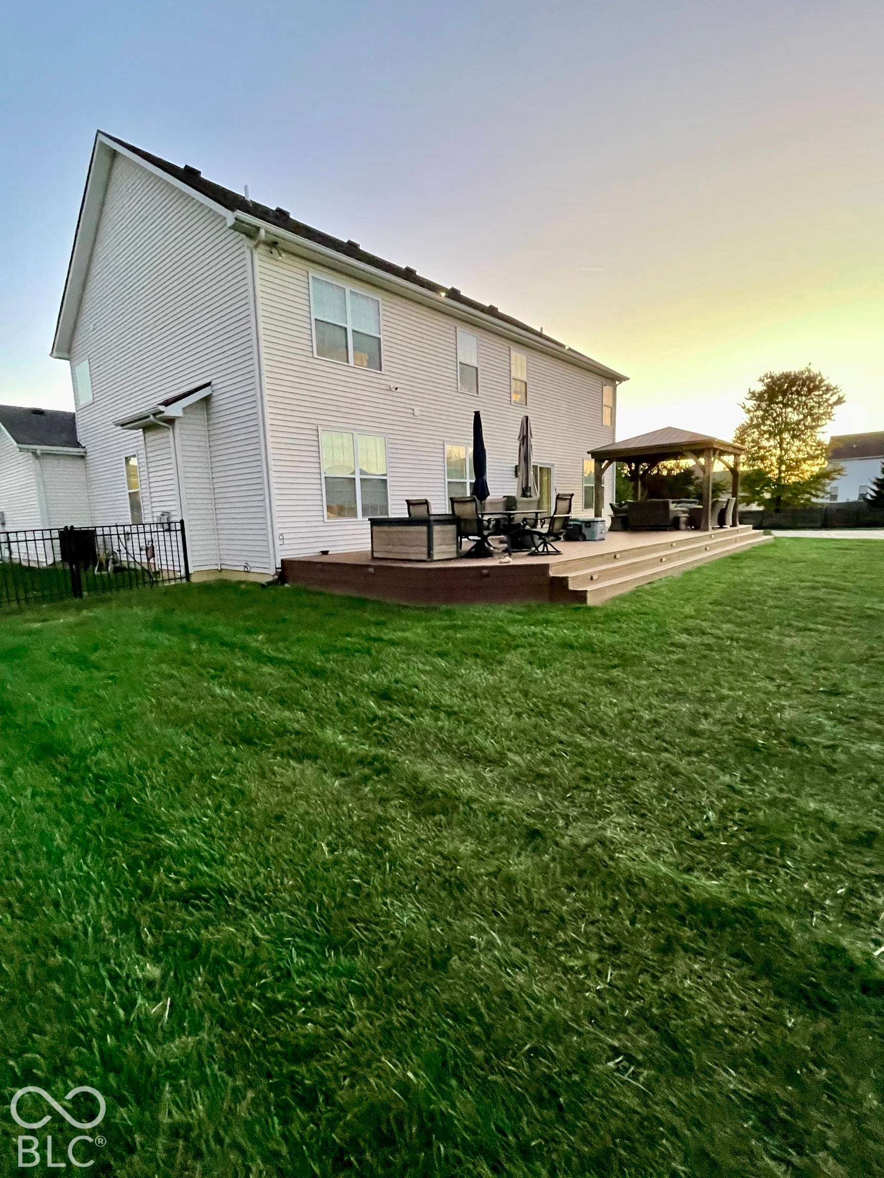 Multi-level deck with integrated step lighting and a covered gazebo