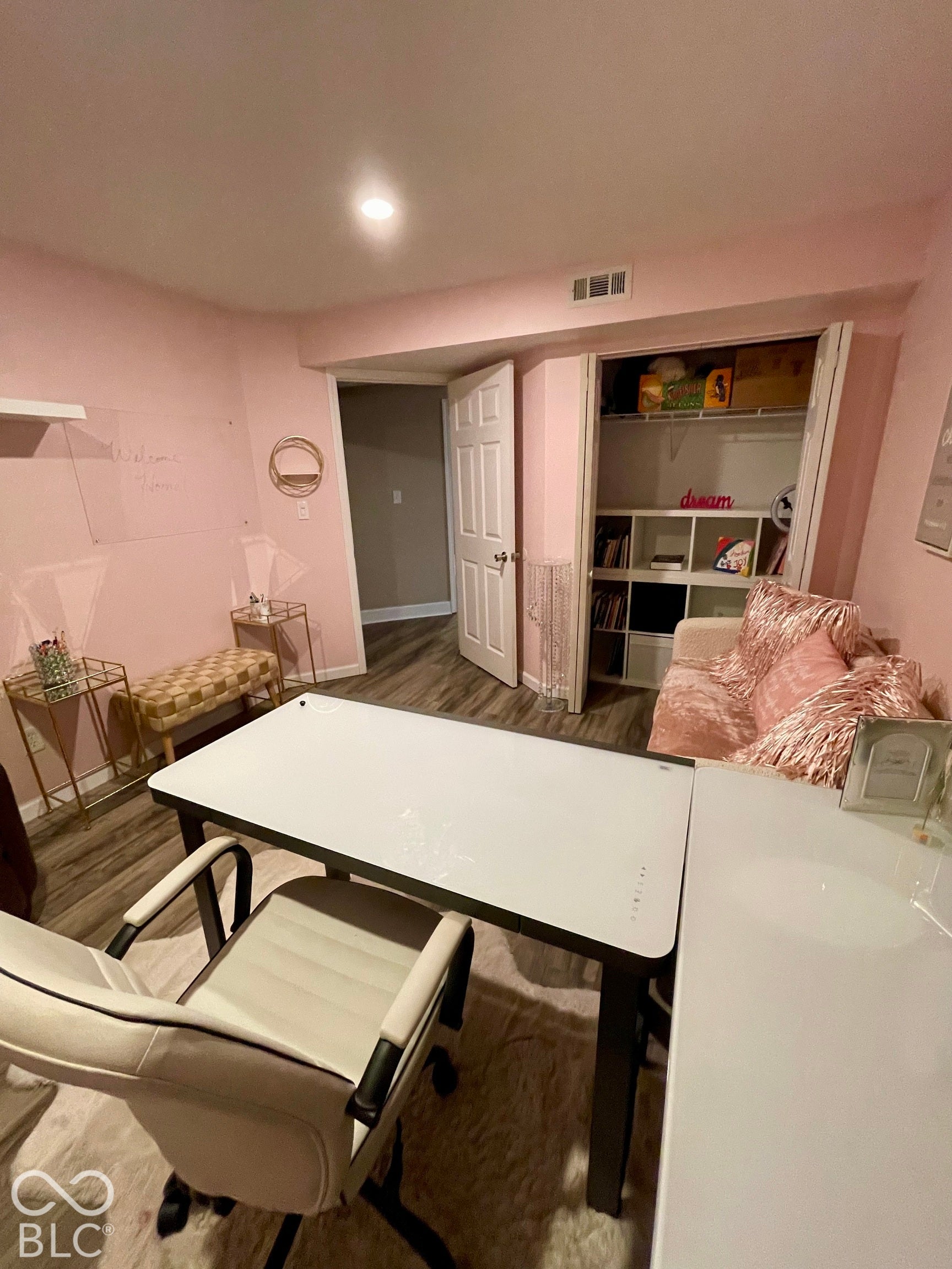 Recessed ceiling lighting, wood-finish flooring, and built-in closet shelving