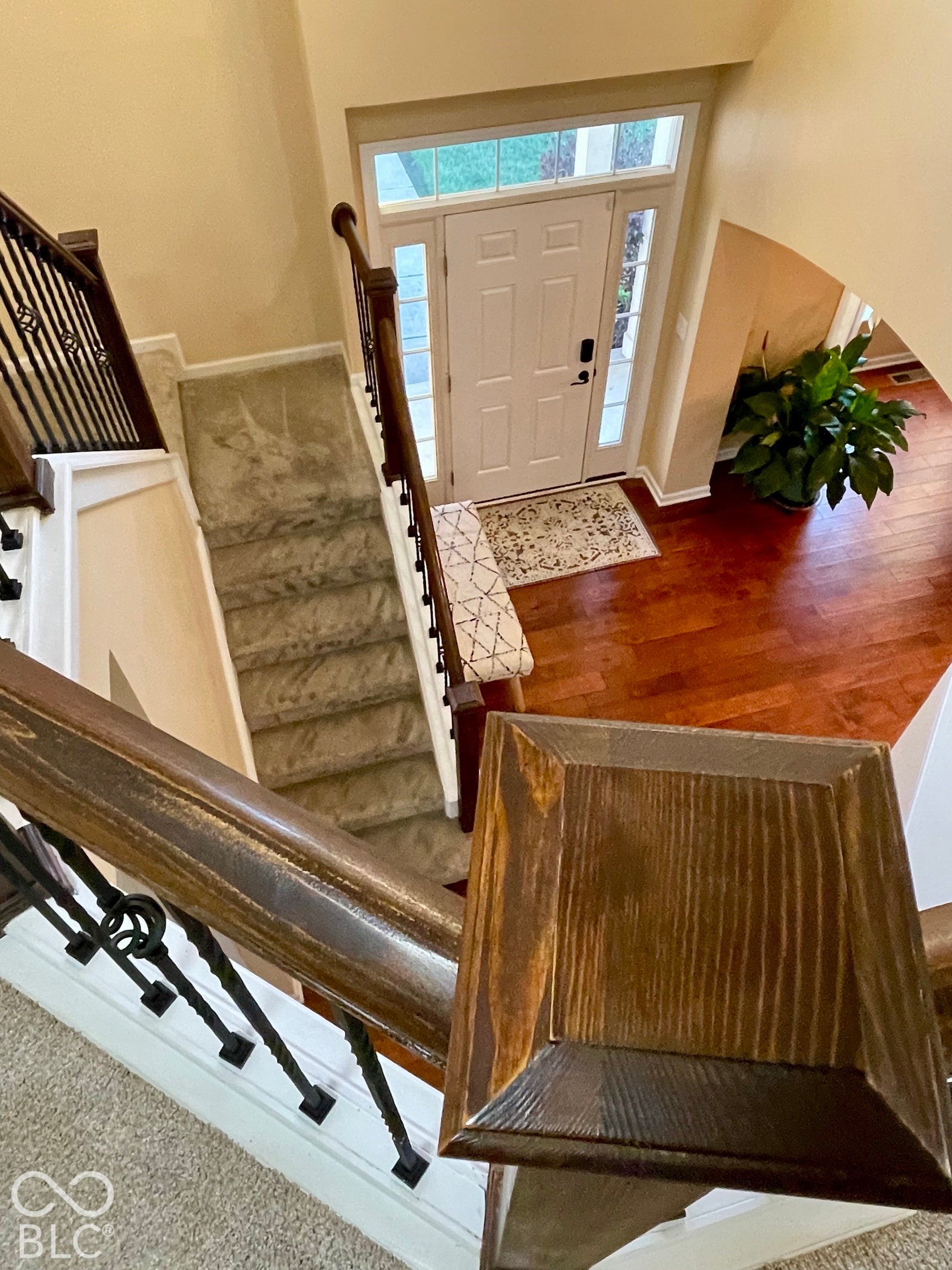 Stunning Two-story foyer with wood-finish flooring