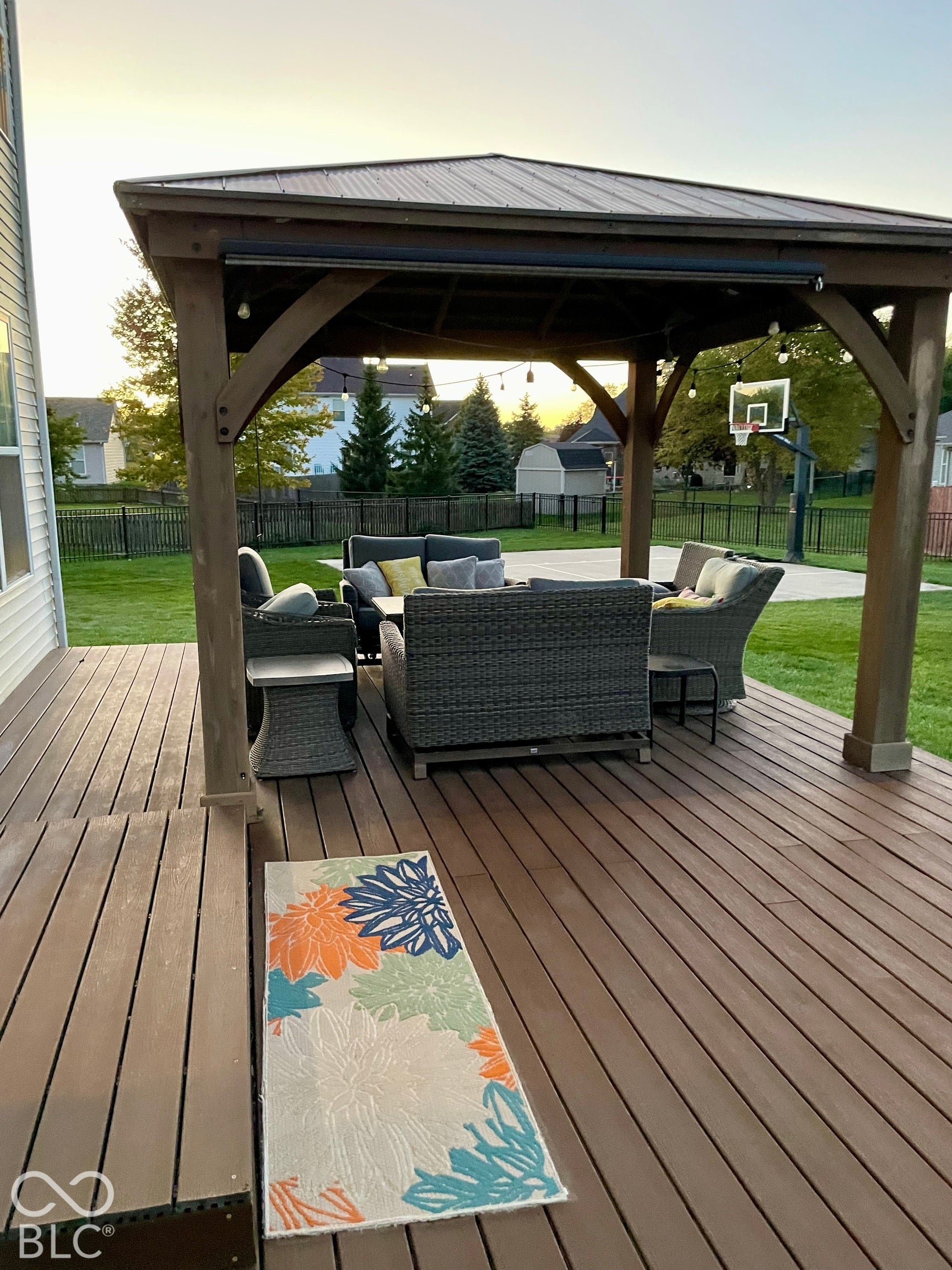 Expansive outdoor deck featuring wood-finish flooring