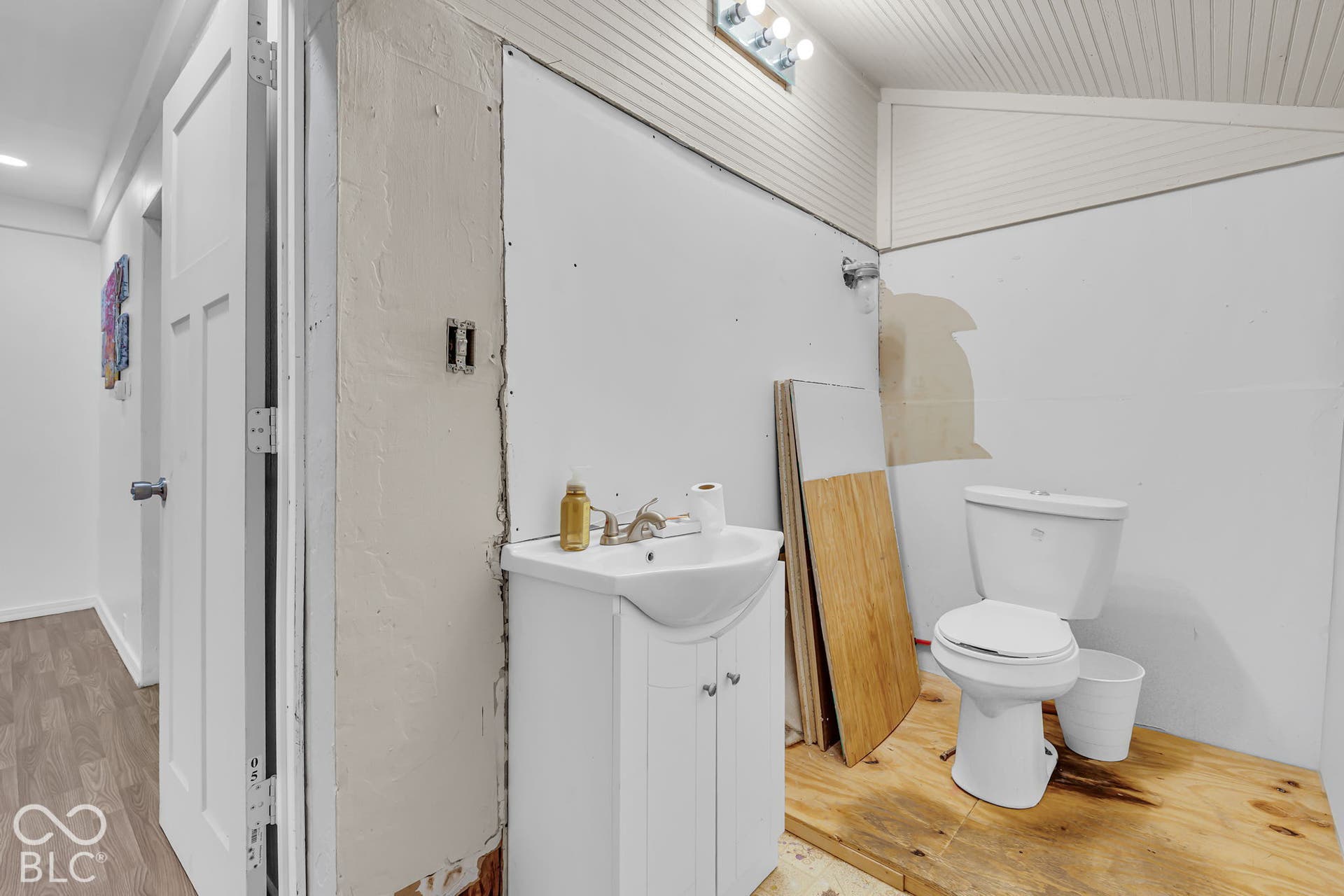 Half bath, main level, in laundry room