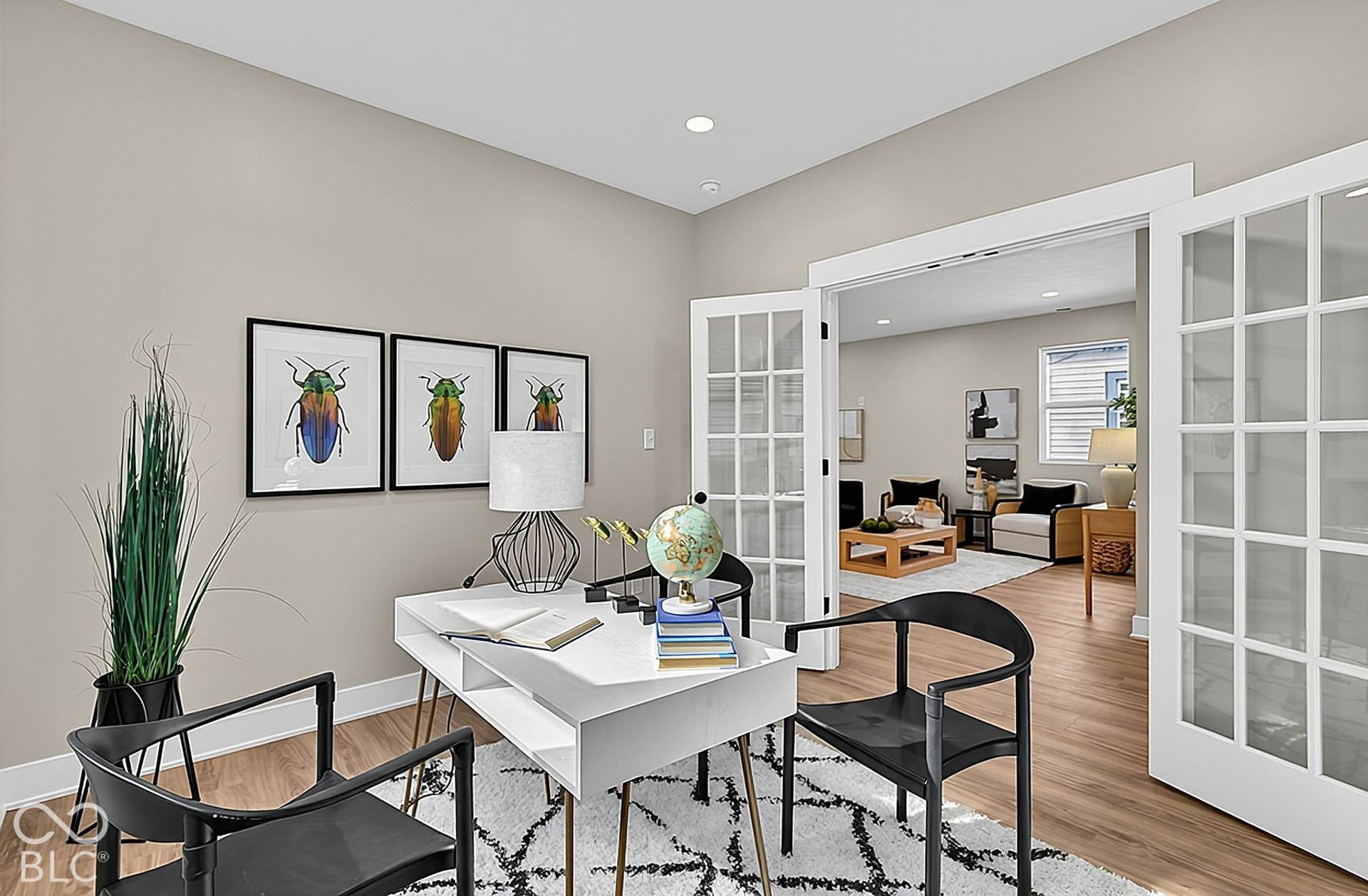 Interior space featuring wood-finish flooring, recessed lighting, and white French doors with glass panes