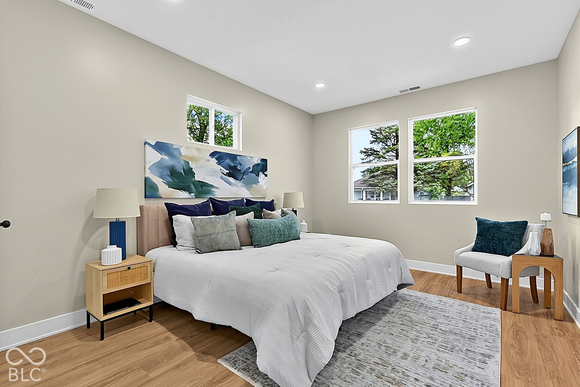 Neutral interior walls, wood-finish flooring, recessed lighting, and dual-pane windows