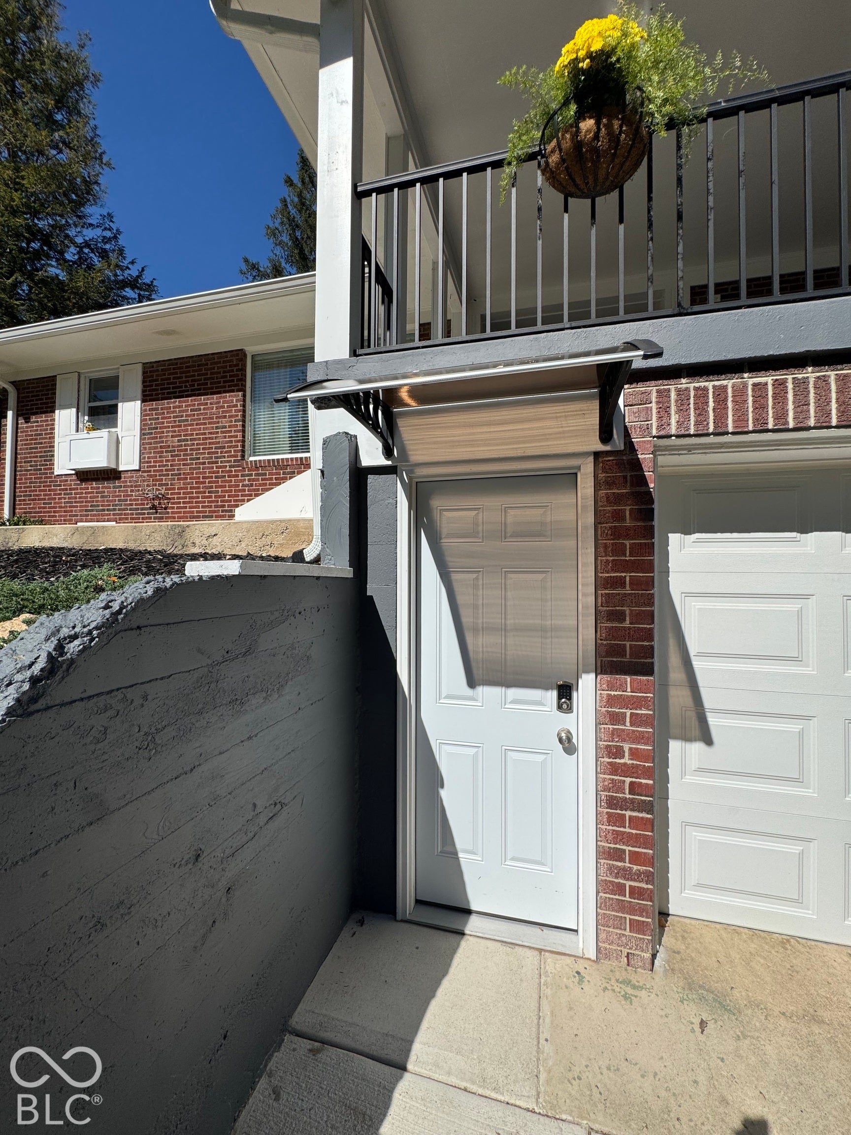 New garage door entry with its own key pad entrylock and New overhang