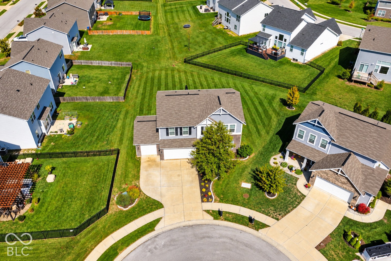 *AI - Color Enhancement* Two-story residence with a two-car garage, concrete driveway, and front yard landscaping