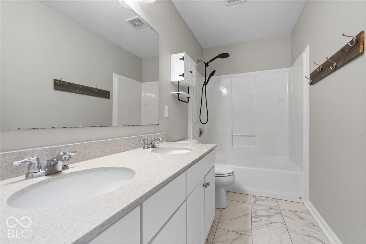 5570 W Stream Drive, McCordsville, IN 46055 Dual vanity with integrated sinks and a light-toned countertop