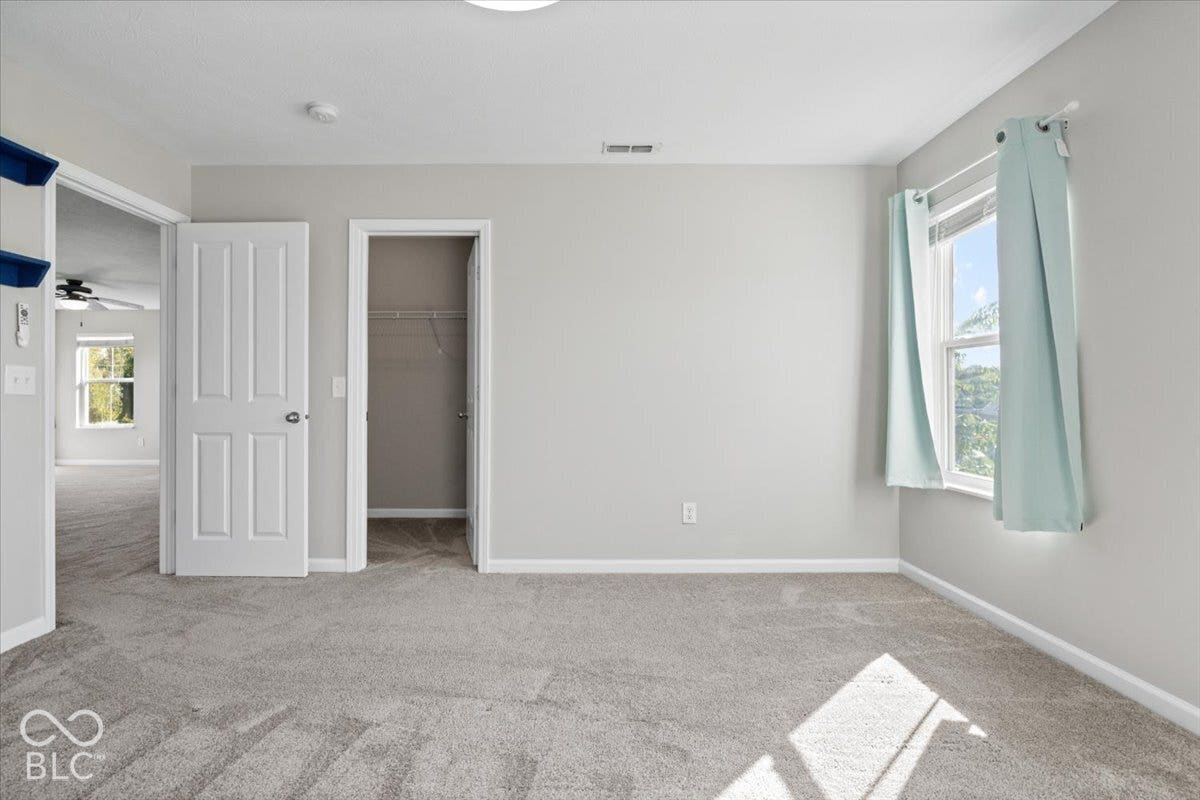 5570 W Stream Drive, McCordsville, IN 46055 Carpeted flooring, white trim, recessed lighting, and a single window
