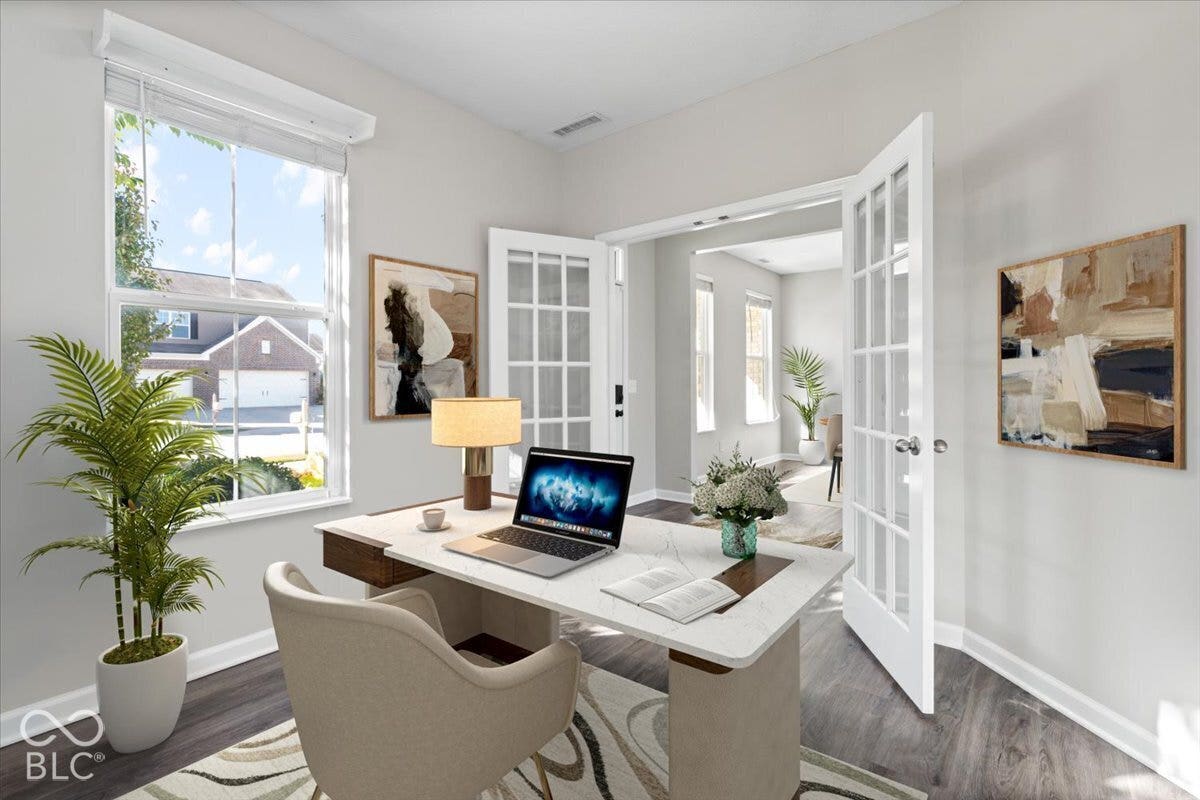 5570 W Stream Drive, McCordsville, IN 46055 Virtually Altered - Light-filled room featuring a large window, French doors with glass panes, wood-finish flooring, and light-toned wall paint