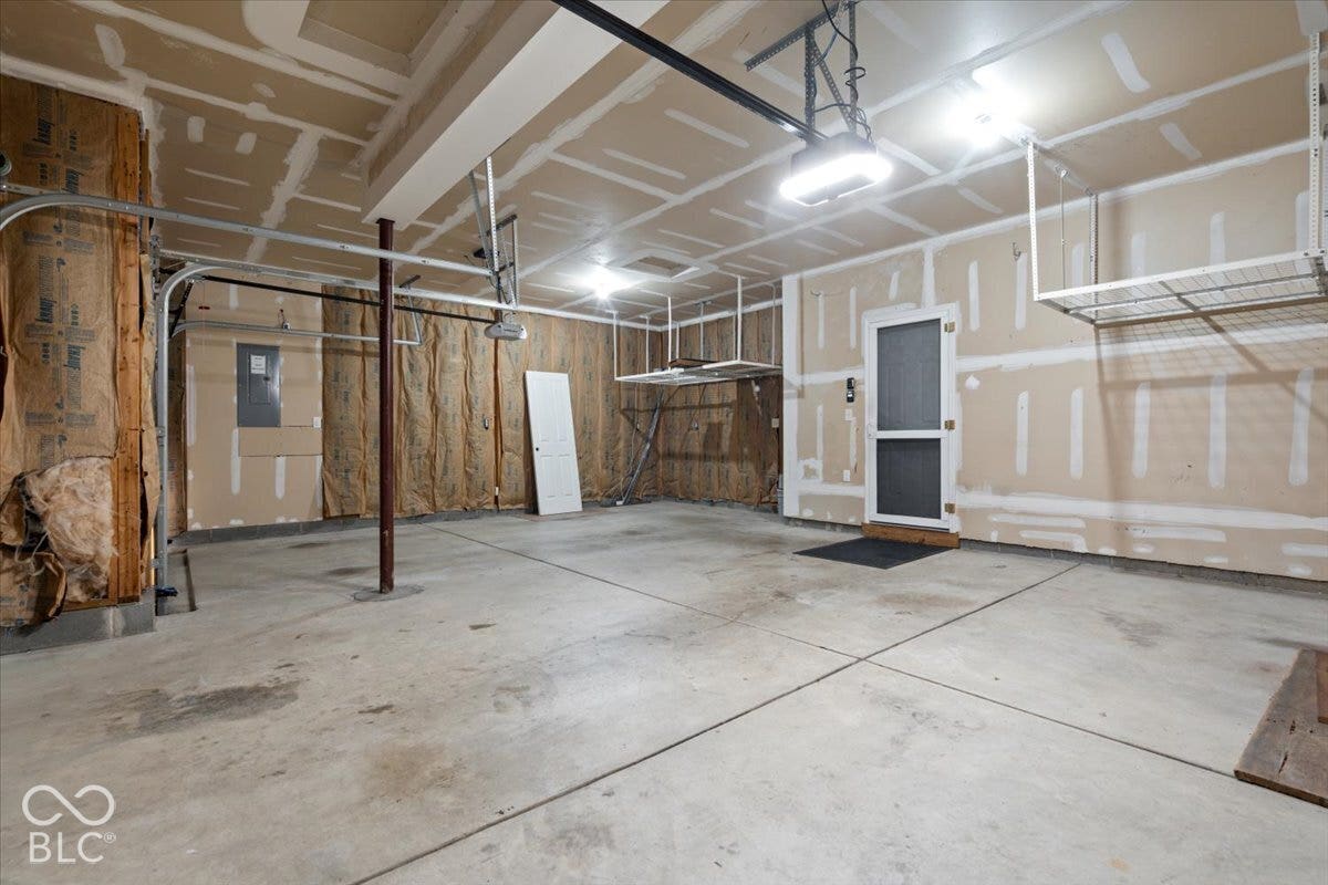 5570 W Stream Drive, McCordsville, IN 46055 Concrete flooring, overhead lighting, overhead storage racks, garage door opener