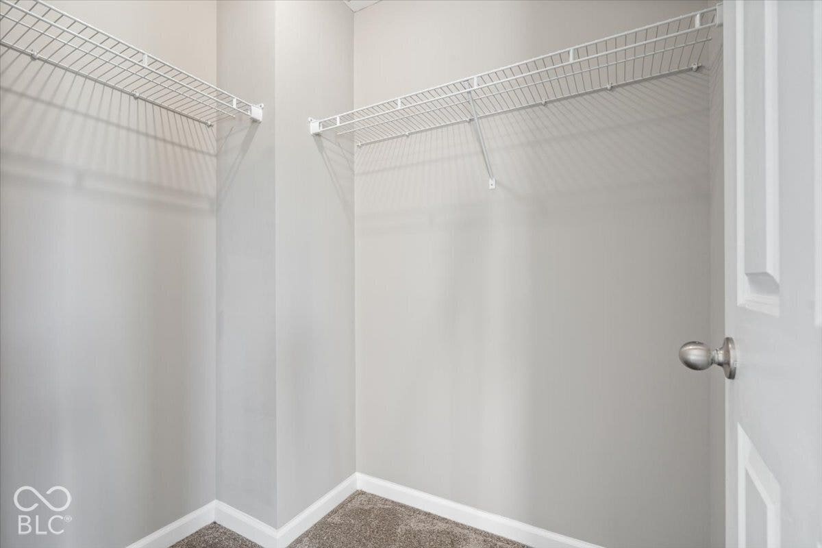 5570 W Stream Drive, McCordsville, IN 46055 Walk-in closet featuring wire shelving and carpet flooring