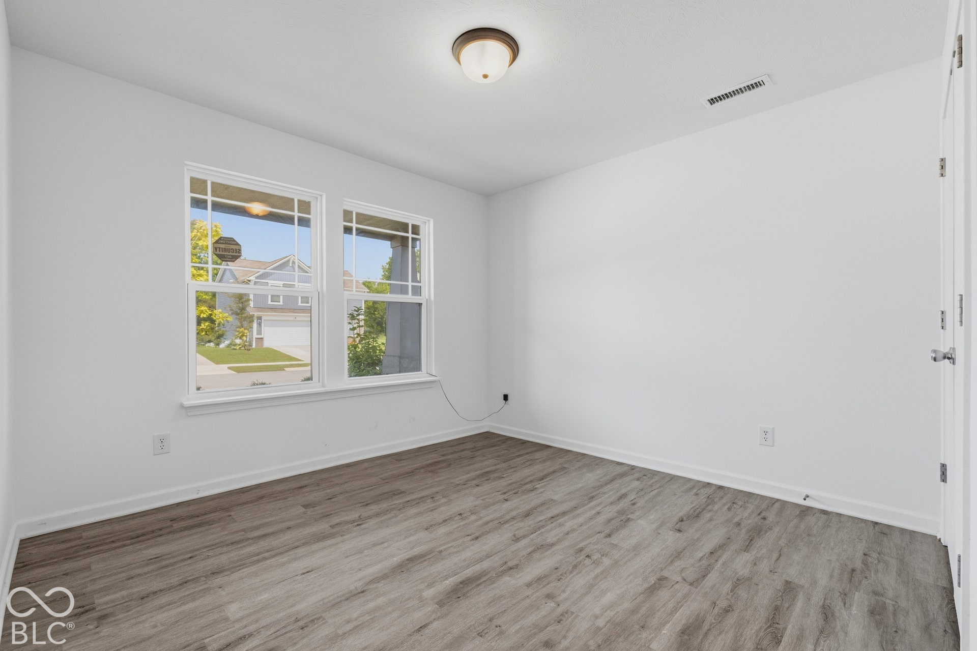 10525 Broadford Street, Indianapolis, IN 46239 Wood-finish flooring, white walls, and dual pane windows