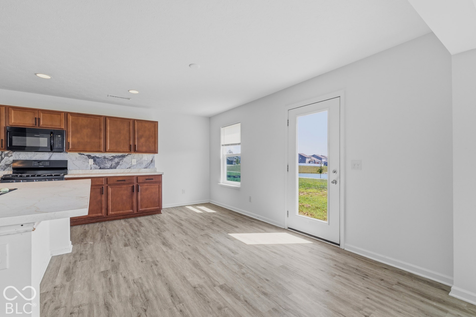 10525 Broadford Street, Indianapolis, IN 46239 Wood-finish flooring, recessed lighting, and a glass-paneled door