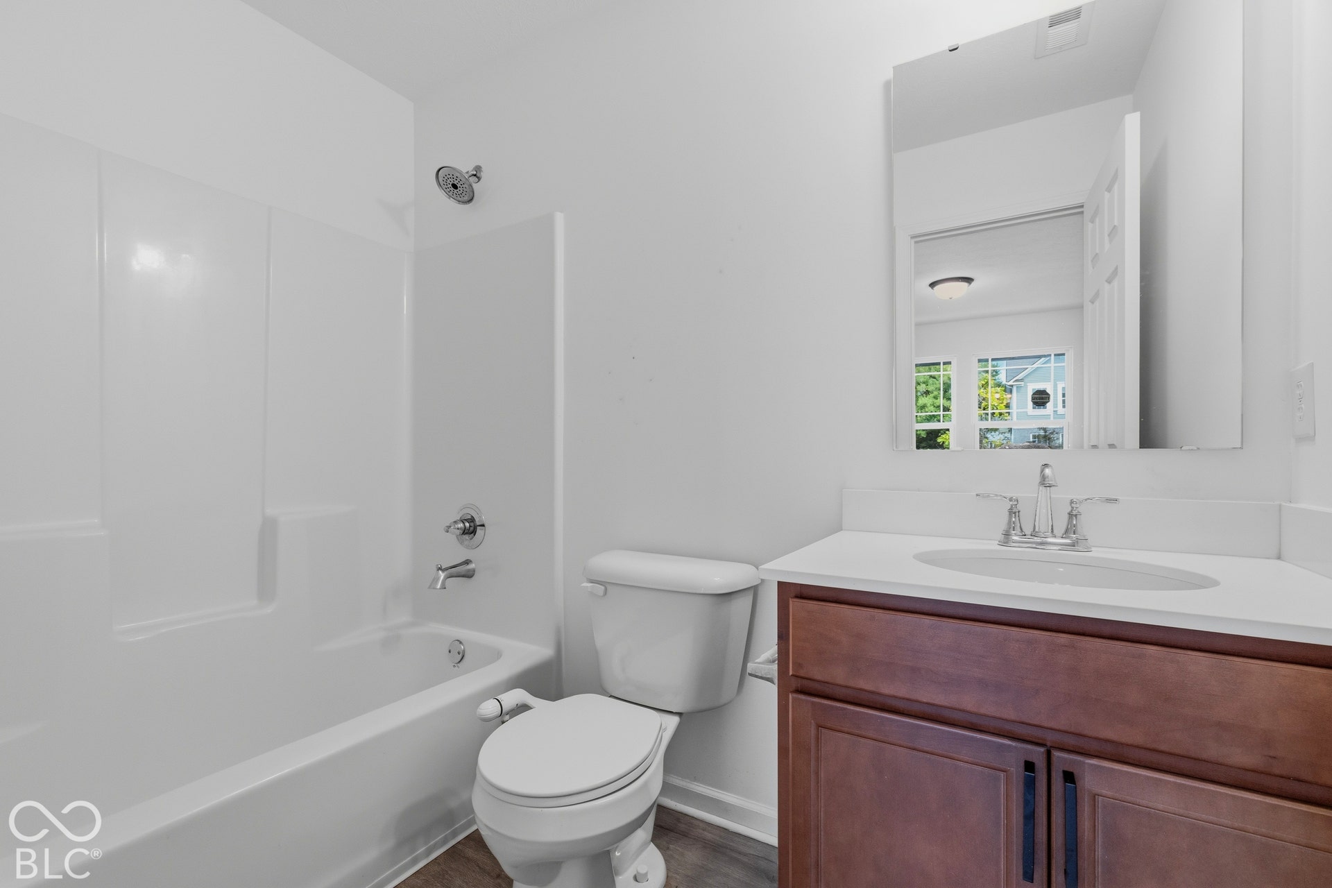 10525 Broadford Street, Indianapolis, IN 46239 White tub and shower combination with chrome fixtures