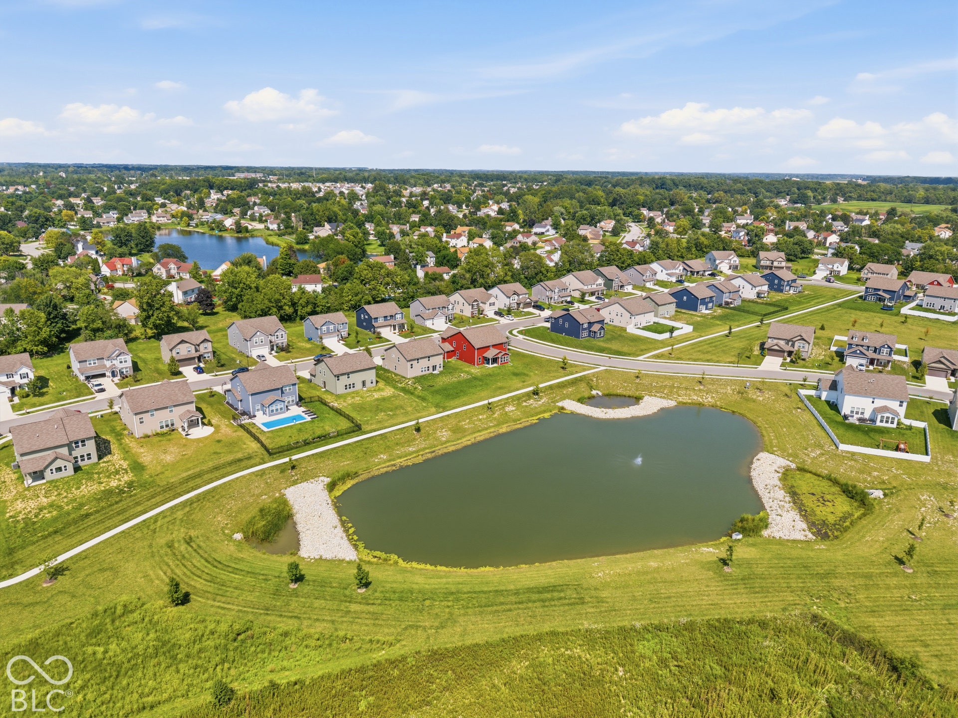 10525 Broadford Street, Indianapolis, IN 46239 Residential development featuring varied home styles, multiple water features, and expansive green spaces