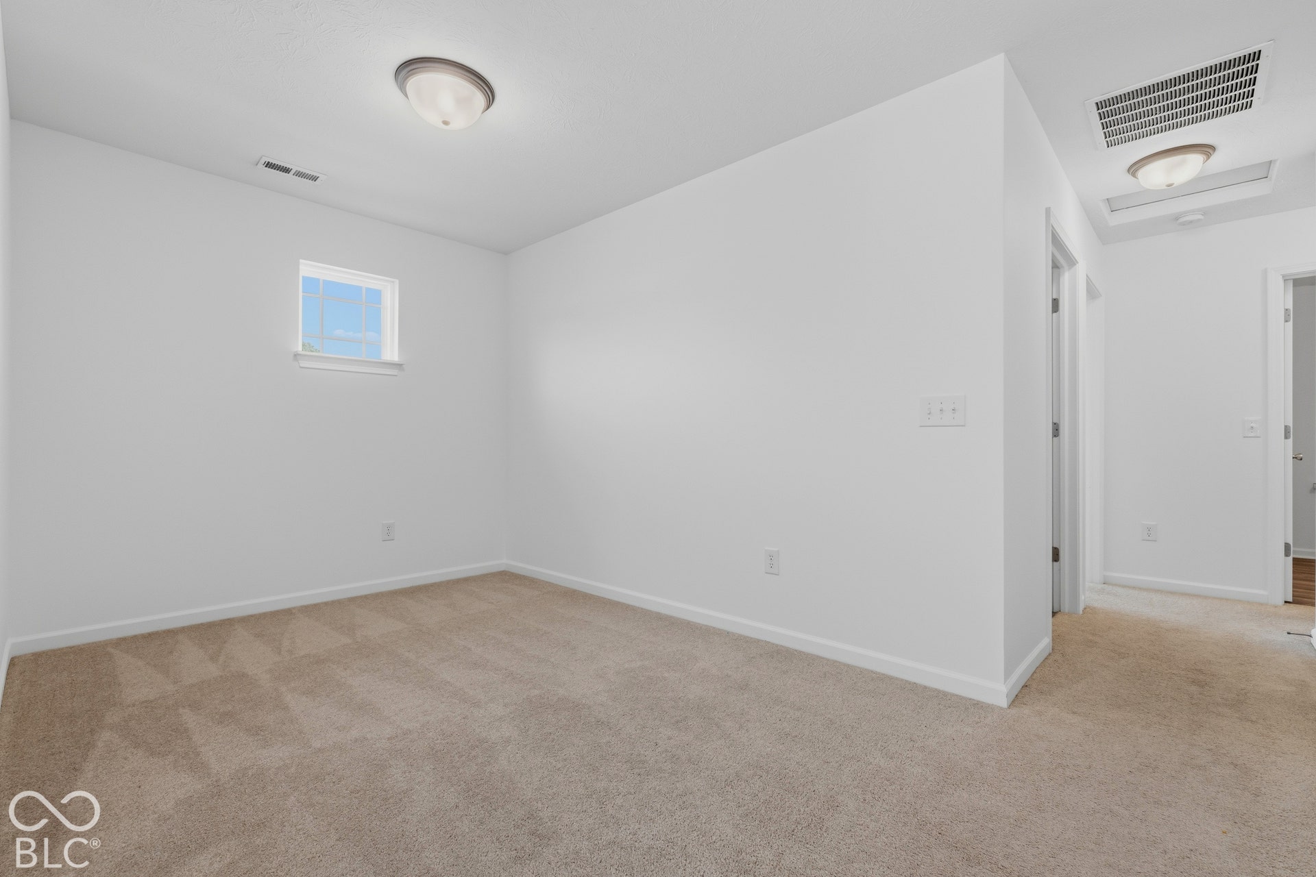 10525 Broadford Street, Indianapolis, IN 46239 Carpeted flooring, white walls, and a window providing natural light