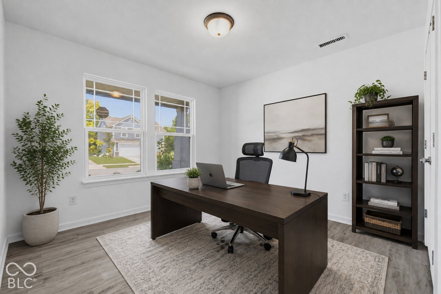 10525 Broadford Street, Indianapolis, IN 46239 Virtually Altered - Dual windows, wood-finish flooring, recessed lighting, and a built-in ceiling light fixture