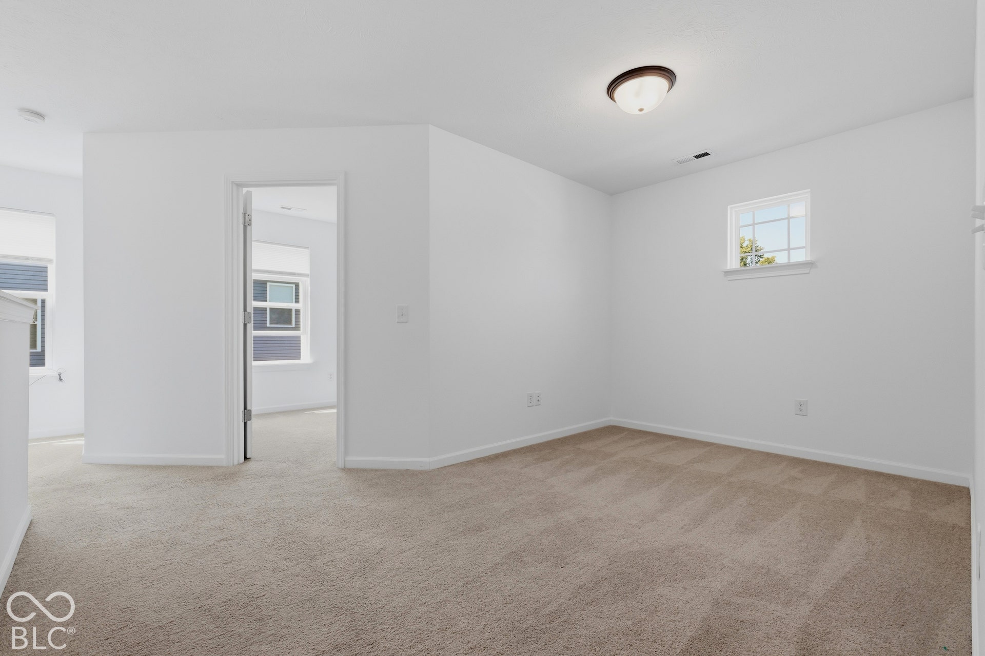 10525 Broadford Street, Indianapolis, IN 46239 Light-colored carpeting, white painted walls, and a ceiling-mounted light fixture