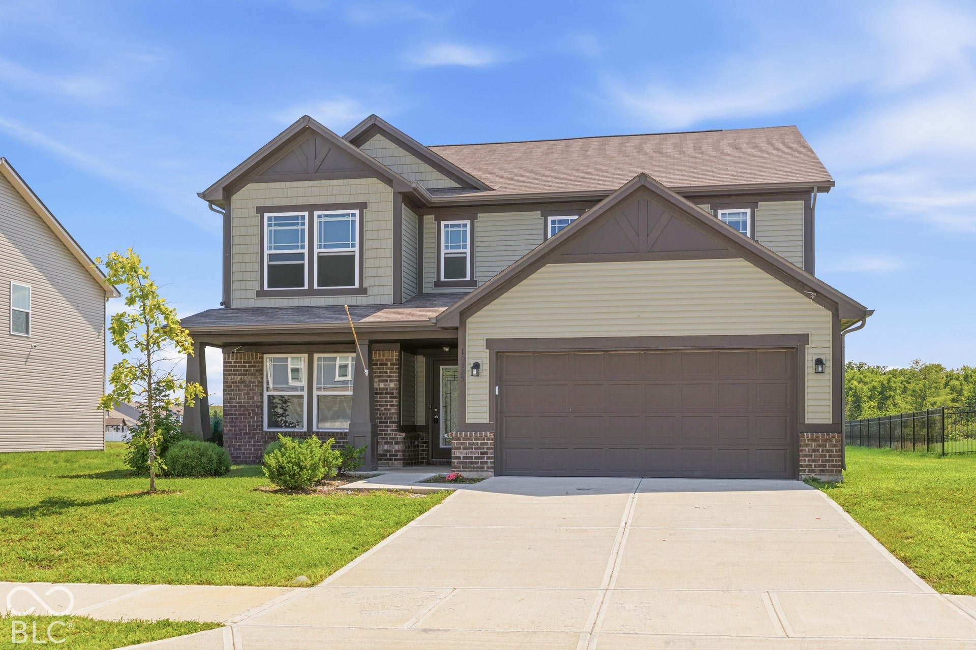 10525 Broadford Street, Indianapolis, IN 46239 Two-story residence featuring a combination of brick and siding, an attached two-car garage, and a concrete driveway