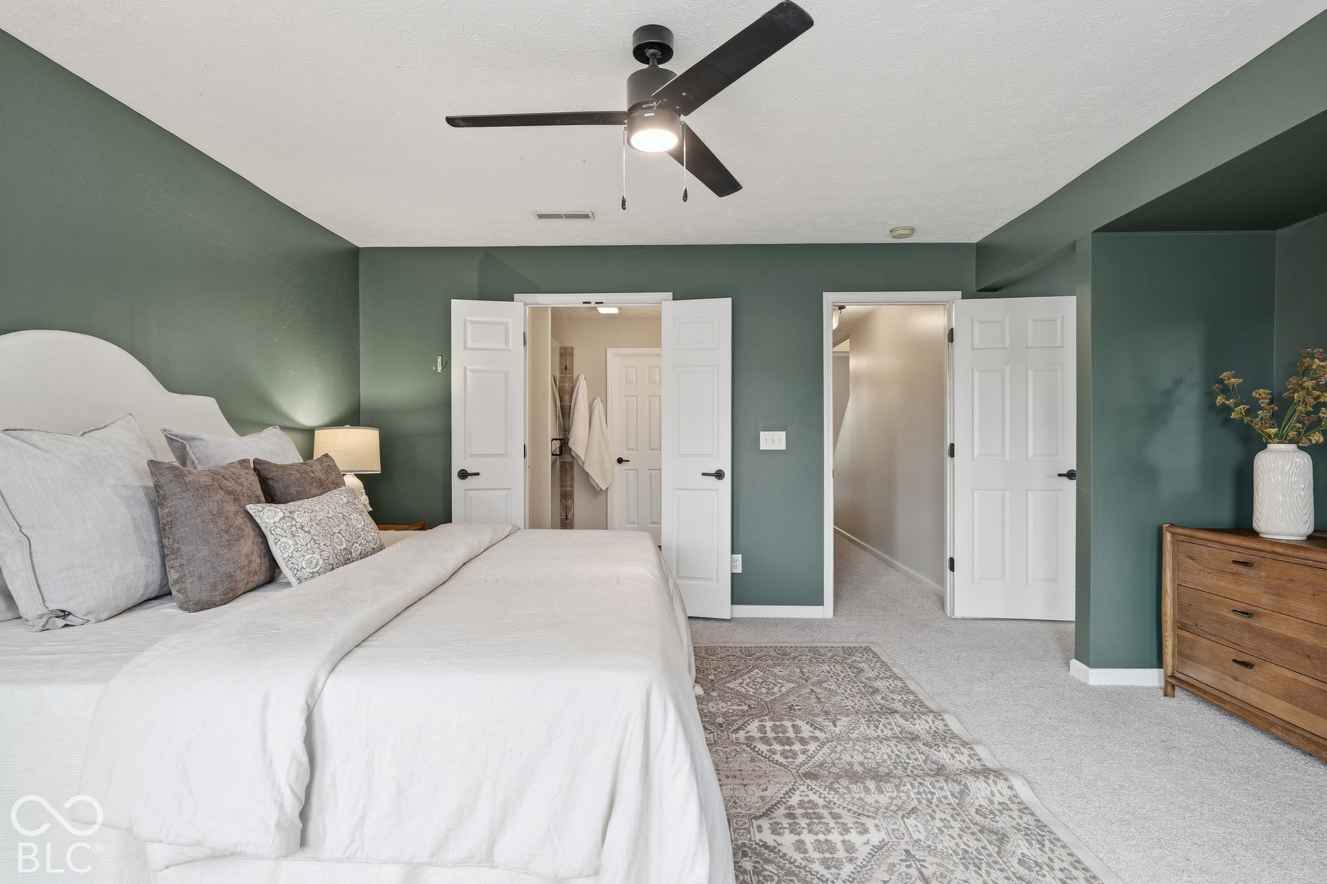 Recessed lighting, ceiling fan, carpet flooring, flat panel doors, and wood-finish dresser
