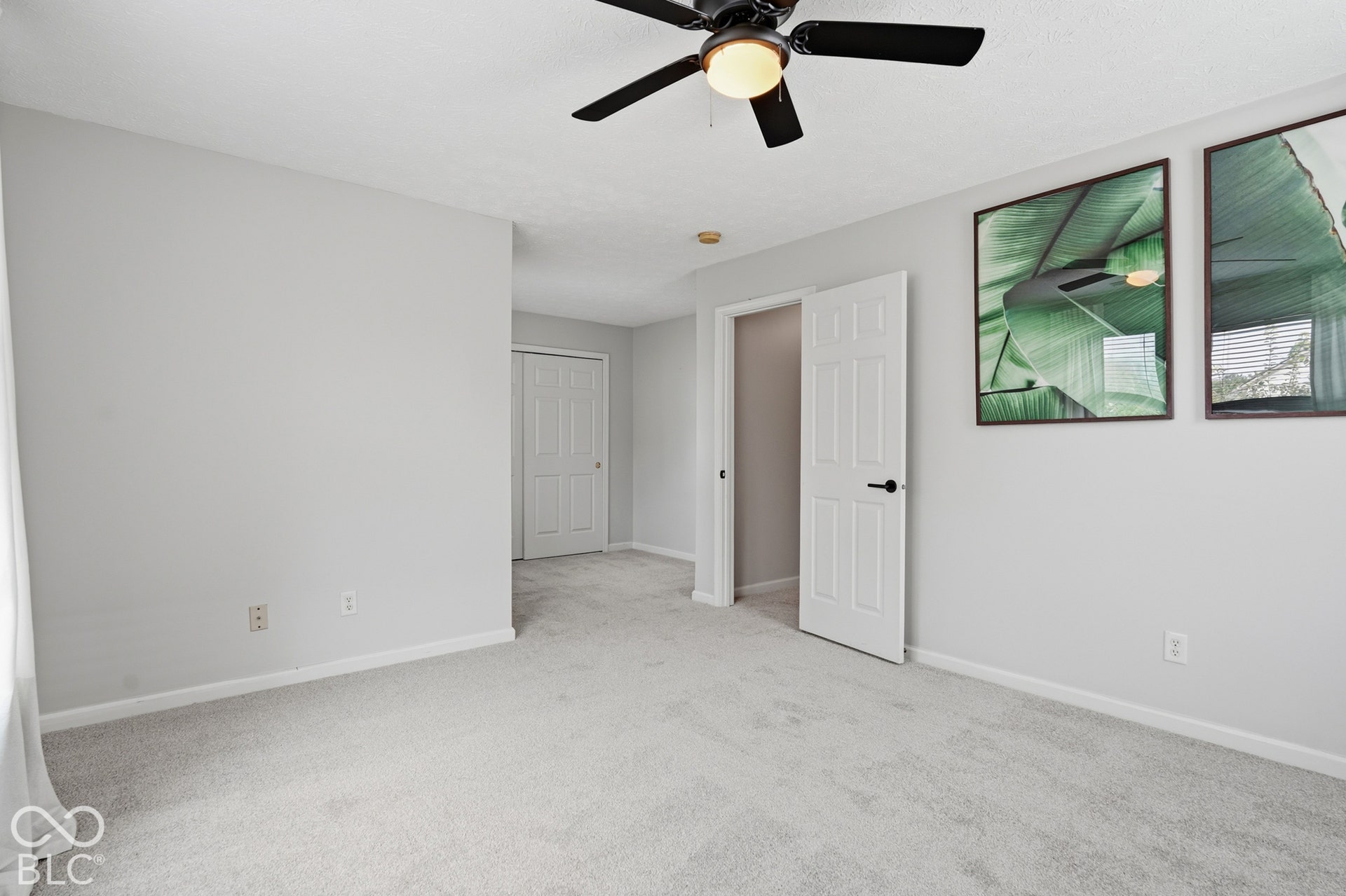 Recessed lighting, ceiling fan, neutral wall paint, white trim, and light-toned carpeting