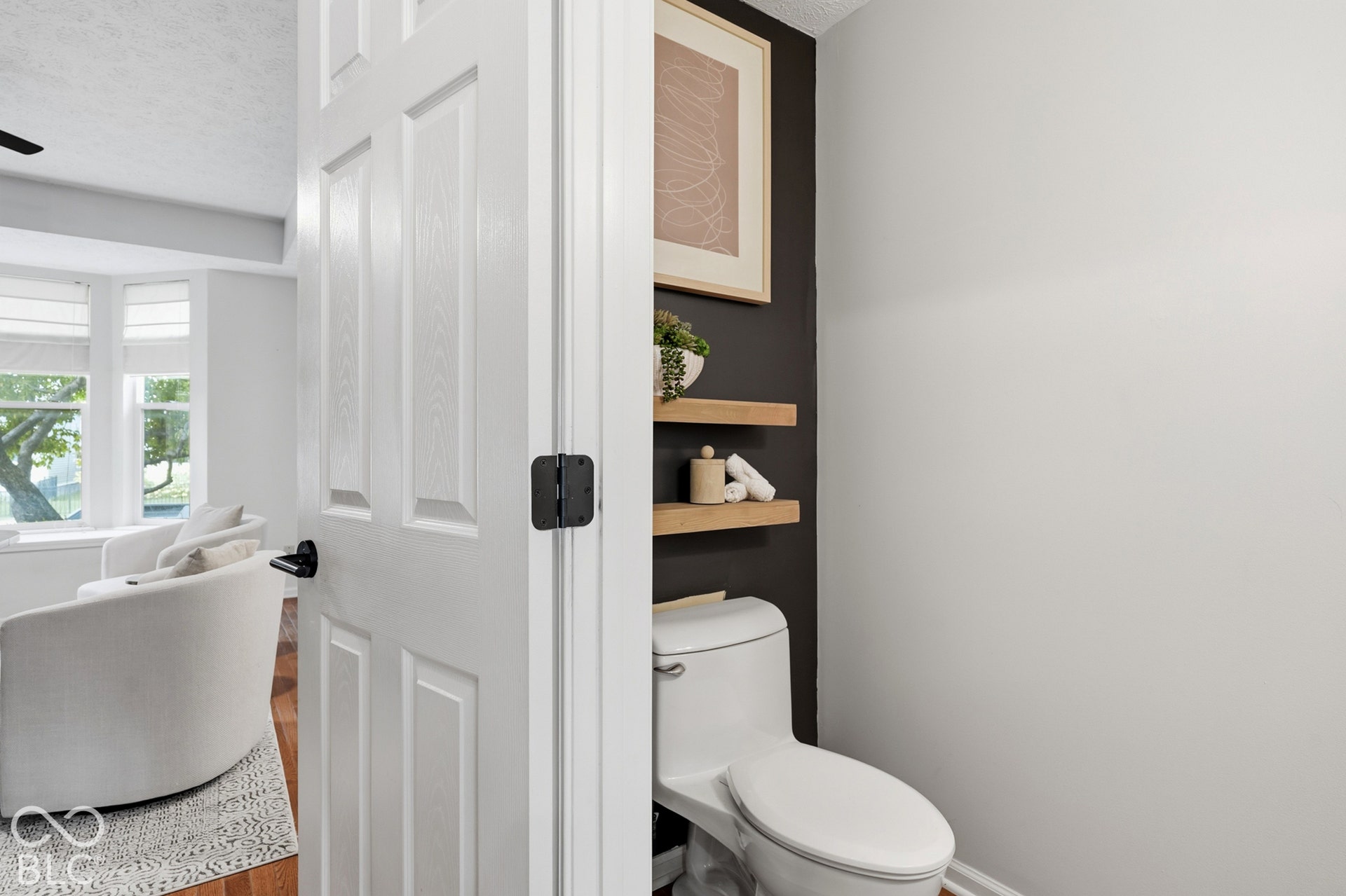 Recessed lighting, hardwood flooring, and bay windows