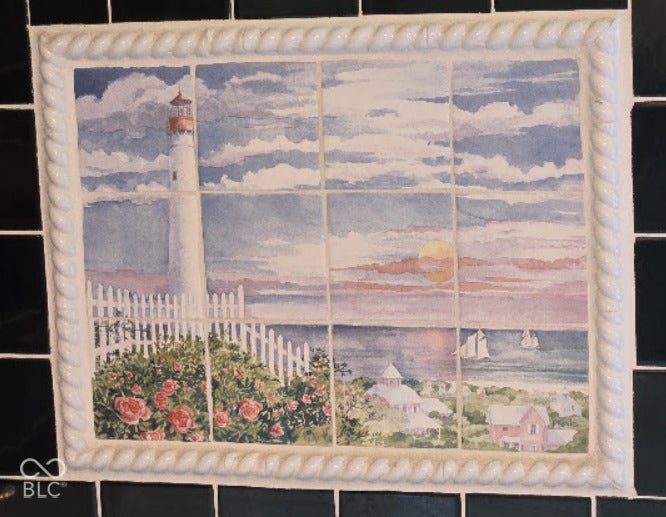 Custom ceramic tile mural with a decorative rope-texture border inset in ceramic behind jet tub.