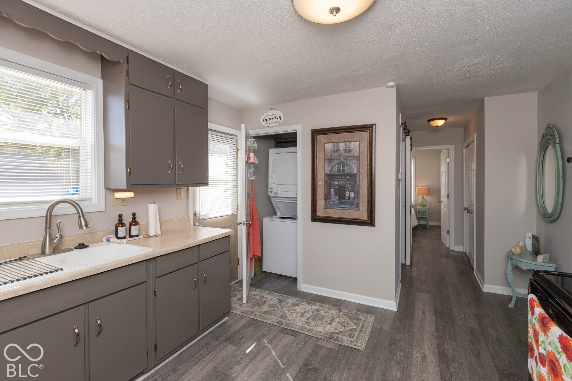 Kitchen with gray cabinetry and light countertops
