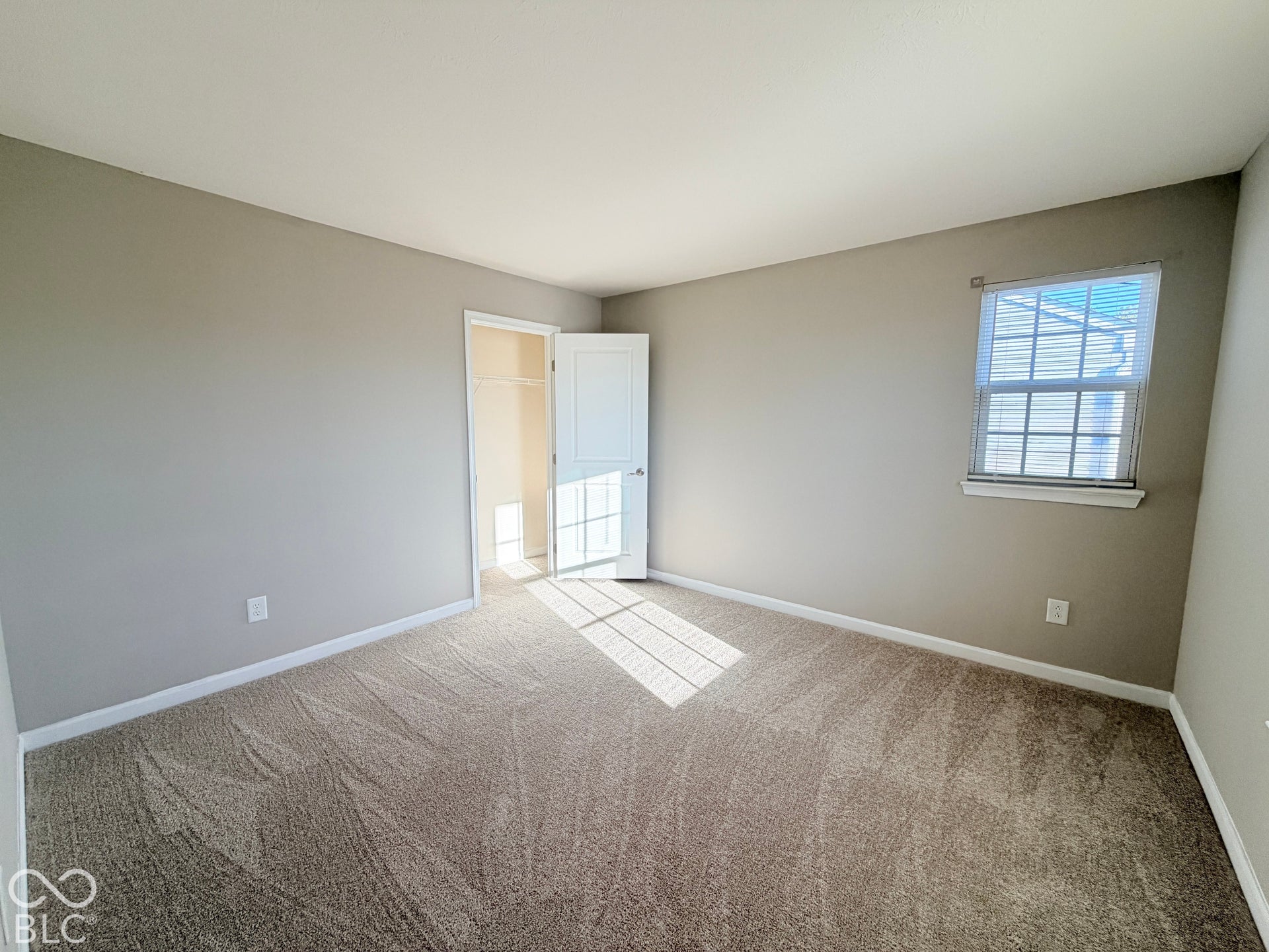652 Classic Lane, Greenwood, IN 46143 Carpeted flooring, neutral wall color, single window with blinds, white trim, and a closet with bifold door