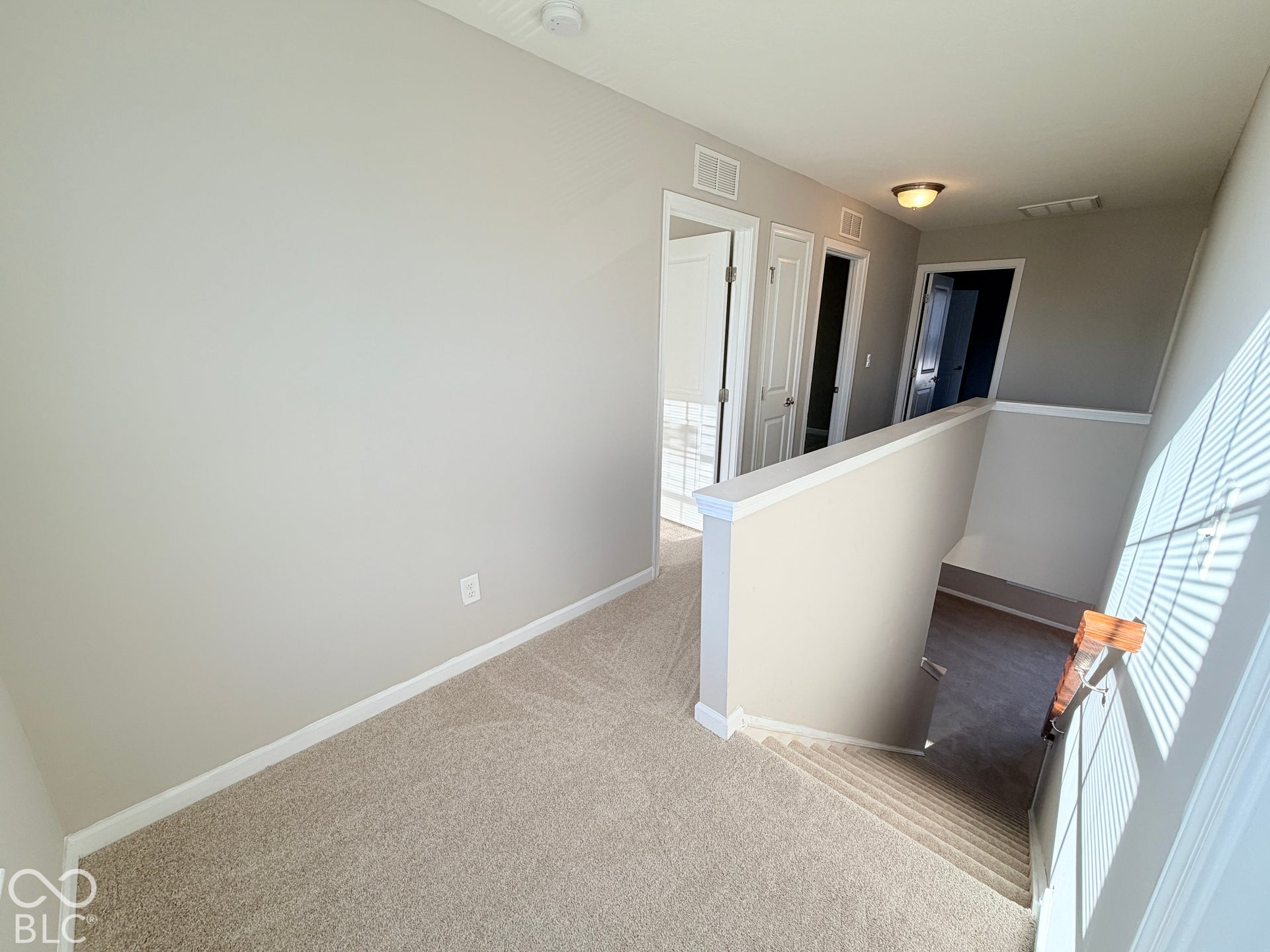 652 Classic Lane, Greenwood, IN 46143 Carpeted hallway with light neutral wall paint, white trim, and recessed lighting