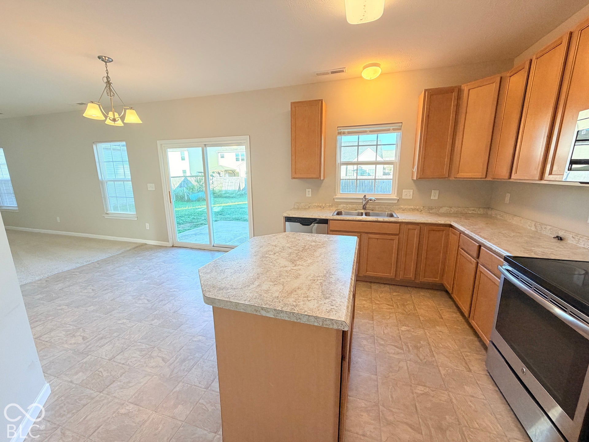 652 Classic Lane, Greenwood, IN 46143 Kitchen with wood-finish cabinetry, stainless steel appliances, and a central island