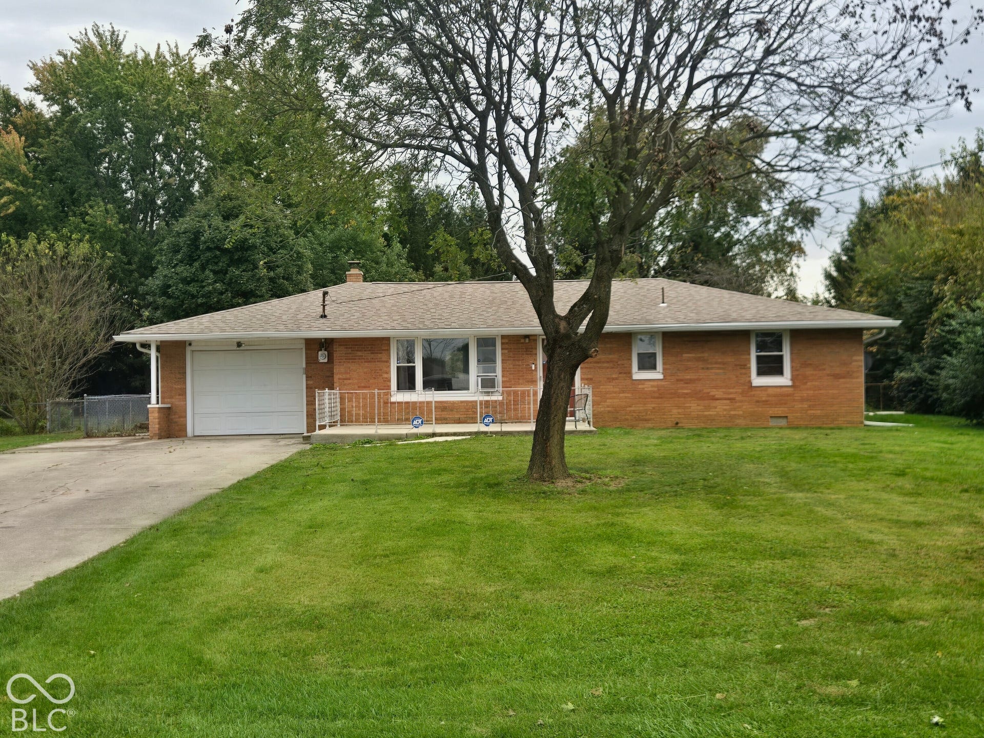 6720 S County Road 800 W, Daleville, IN 47334 Brick exterior with a single-car garage and a paved driveway