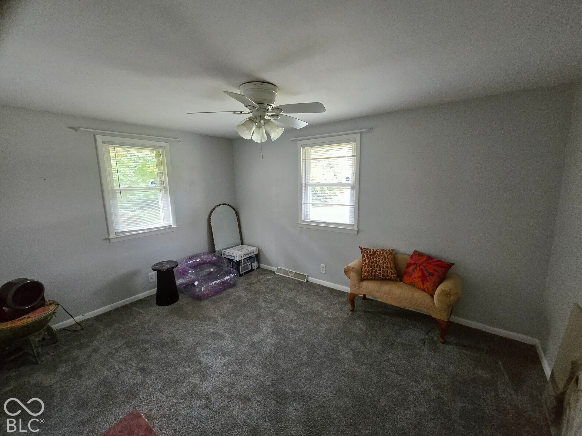 6720 S County Road 800 W, Daleville, IN 47334 Gray wall paint, two single-hung windows, and a ceiling fan