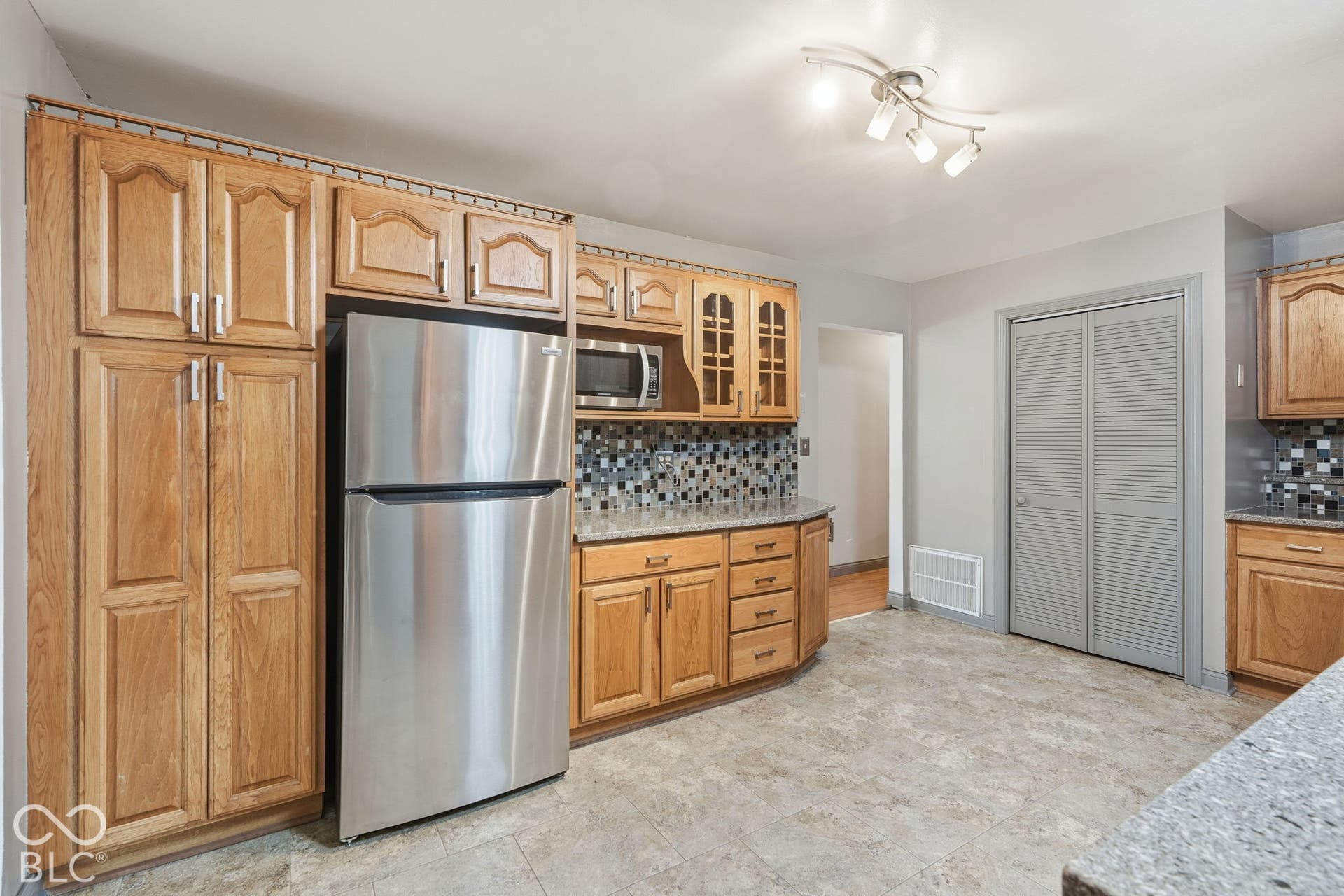 4937 E Edgewood, Indianapolis, IN 46237 Plenty of kitchen storage and workspace inside this rare Indianapolis property featuring 1.98 acres, fenced pasture, and a 3-stall horse barn.