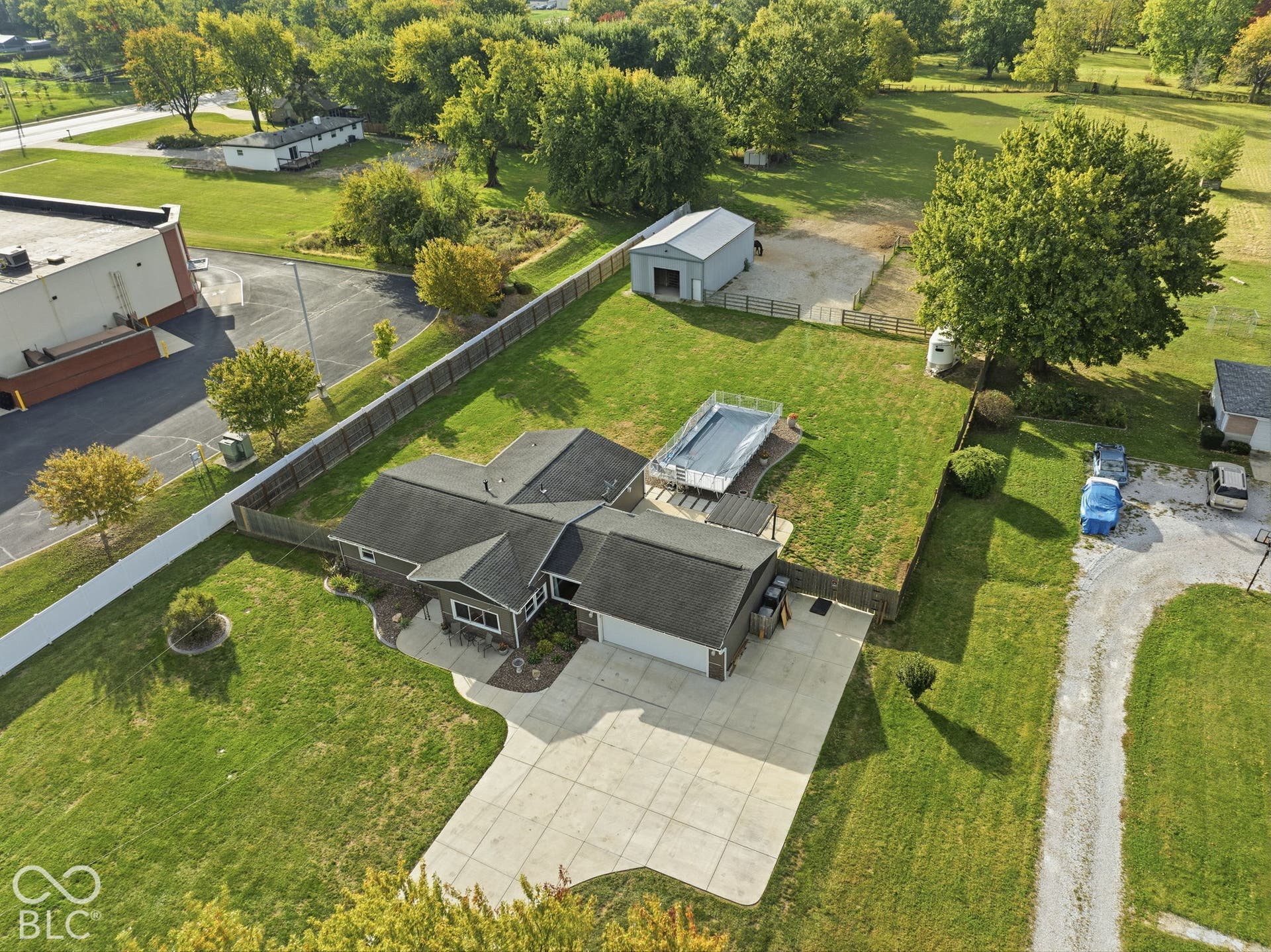 4937 E Edgewood, Indianapolis, IN 46237 Horse-property buyers, take a look: fenced acreage, an on-site barn and plenty of usable outdoor space surround the home and pool.