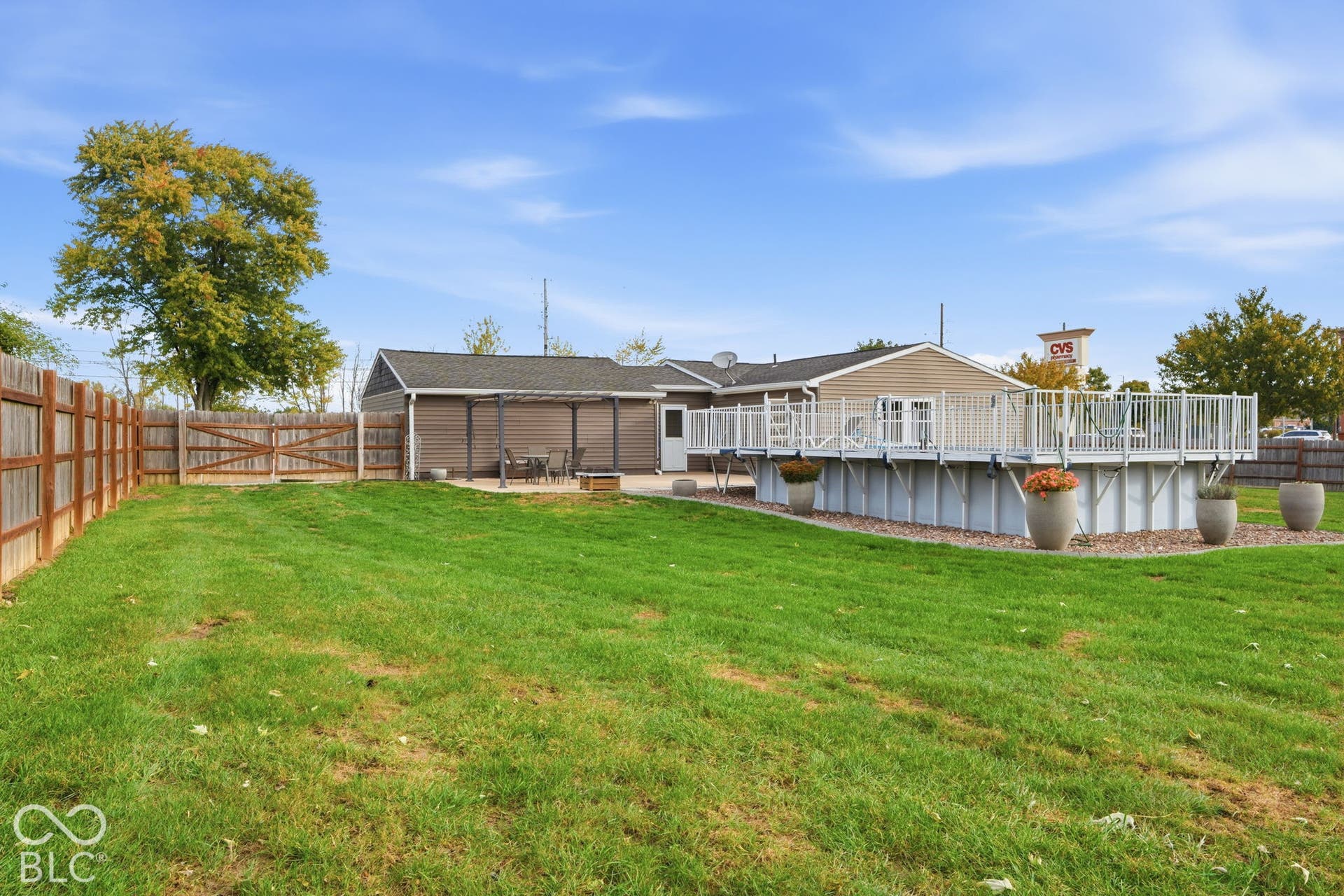 4937 E Edgewood, Indianapolis, IN 46237 The front portion of the backyard is separately fenced, your dogs and kids will love it!
