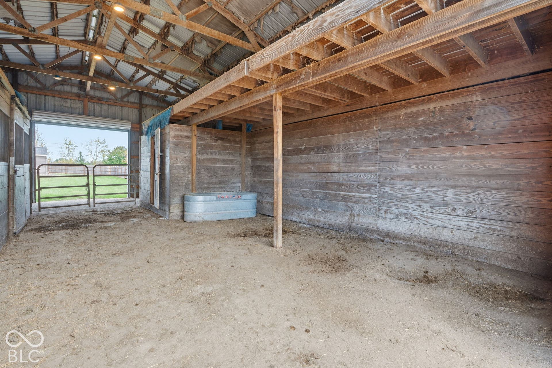 4937 E Edgewood, Indianapolis, IN 46237 Functional barn space provides stalls, storage and room for the equipment that comes with keeping horses at home.