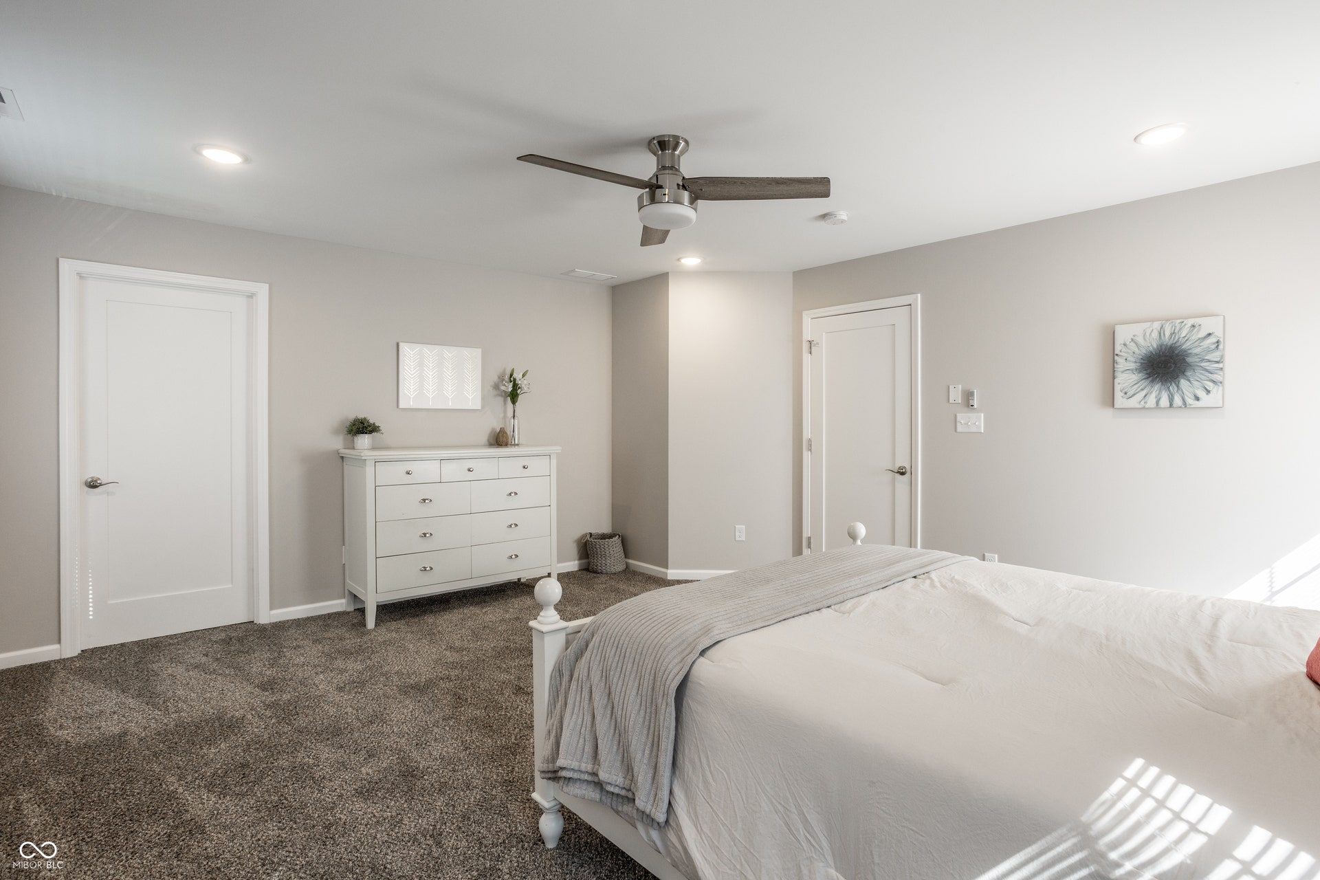 2323 E 57th Street, Indianapolis, IN 46220 Plush carpet flooring, recessed lighting, ceiling fan, and solid interior doors