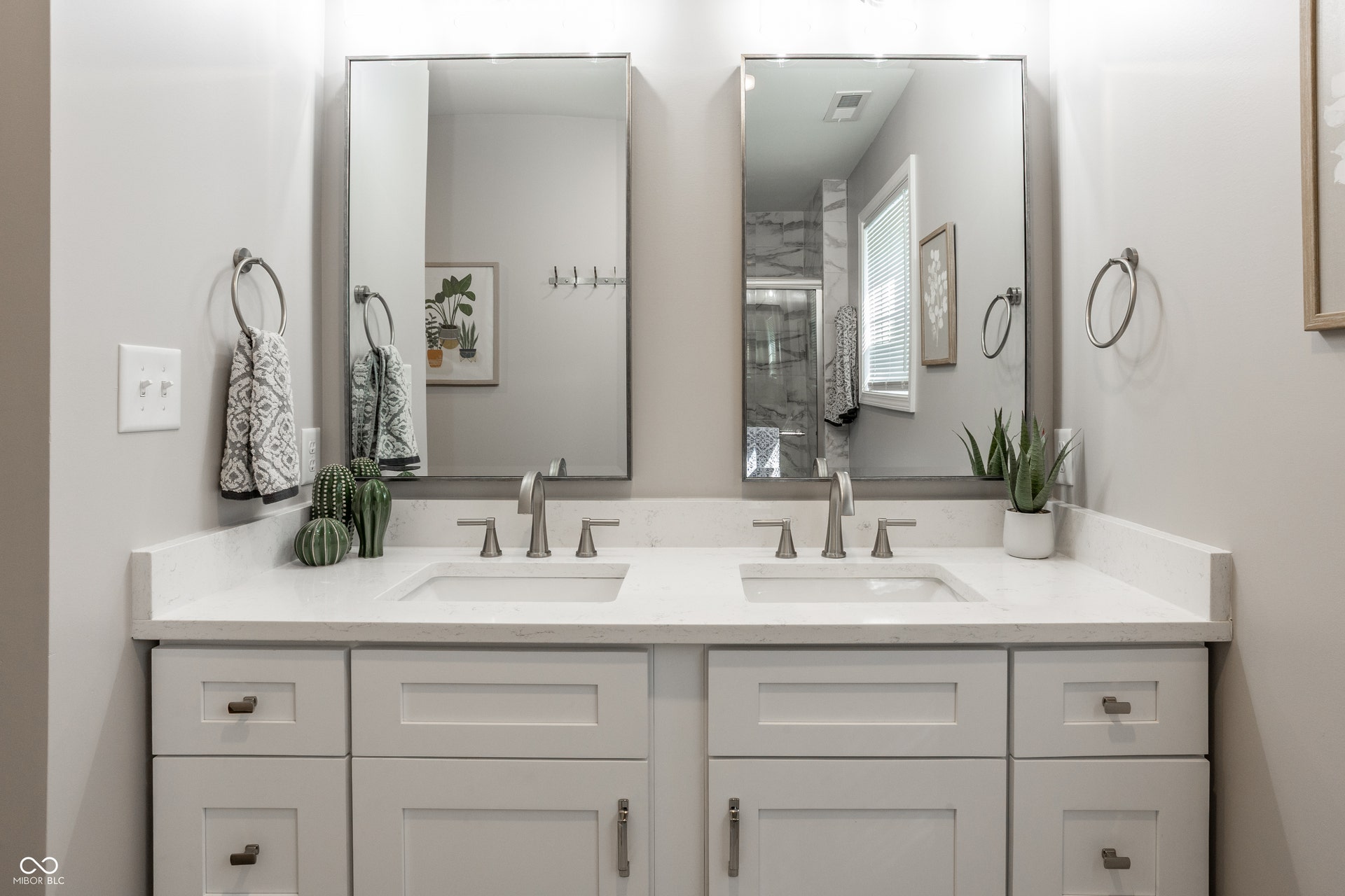 2323 E 57th Street, Indianapolis, IN 46220 Dual vanity with white cabinetry and integrated sinks