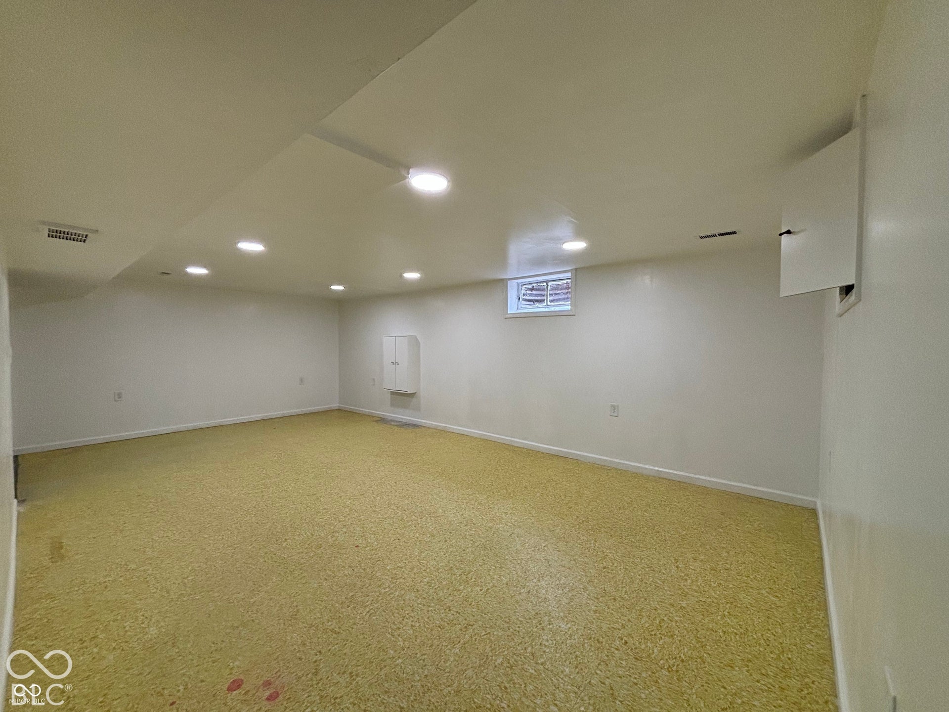 1345 Carroll White Drive, Indianapolis, IN 46219 Recessed lighting, painted walls, and window