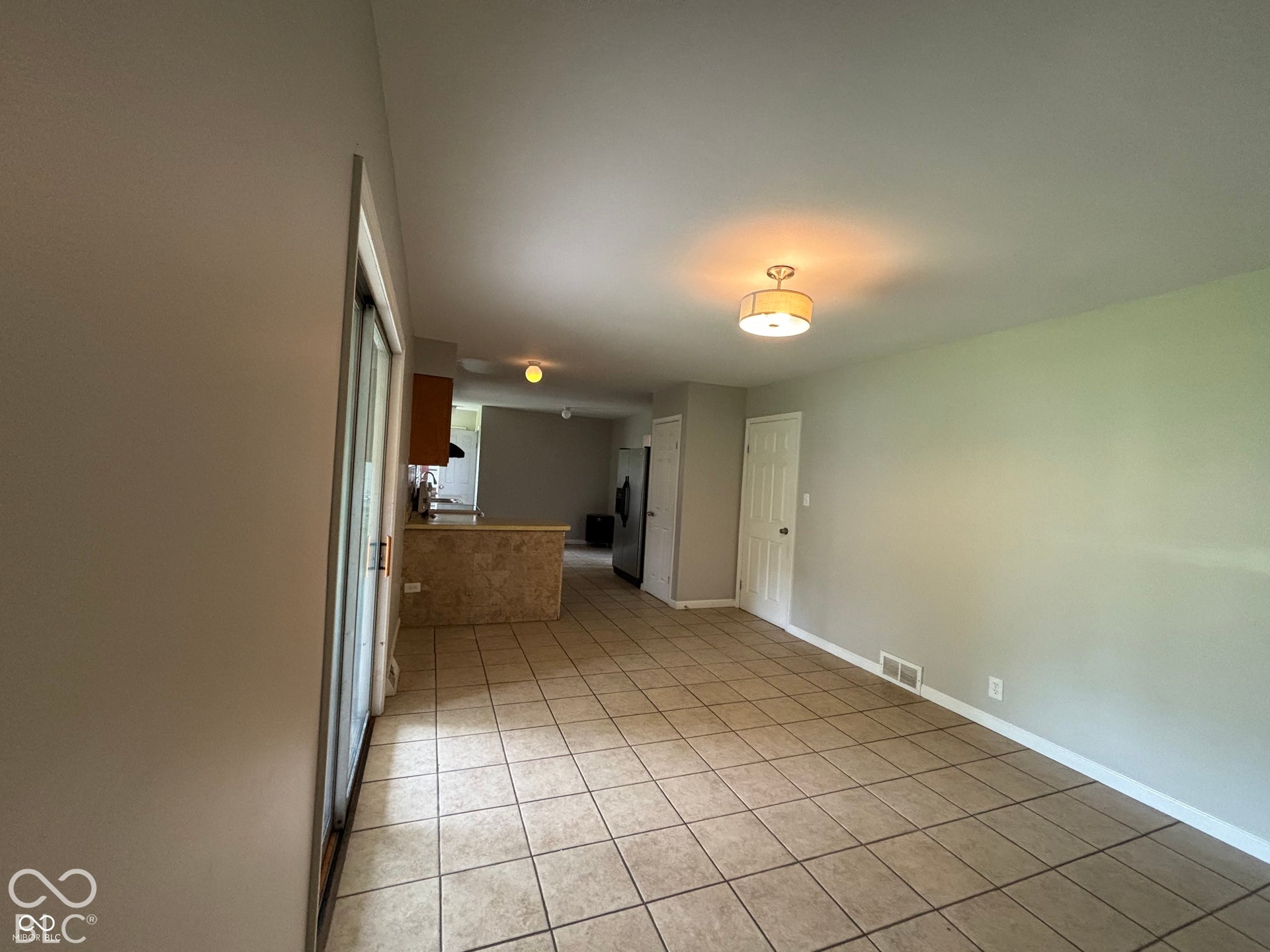 1345 Carroll White Drive, Indianapolis, IN 46219 Tile flooring throughout, neutral painted walls, and a contemporary ceiling light fixture