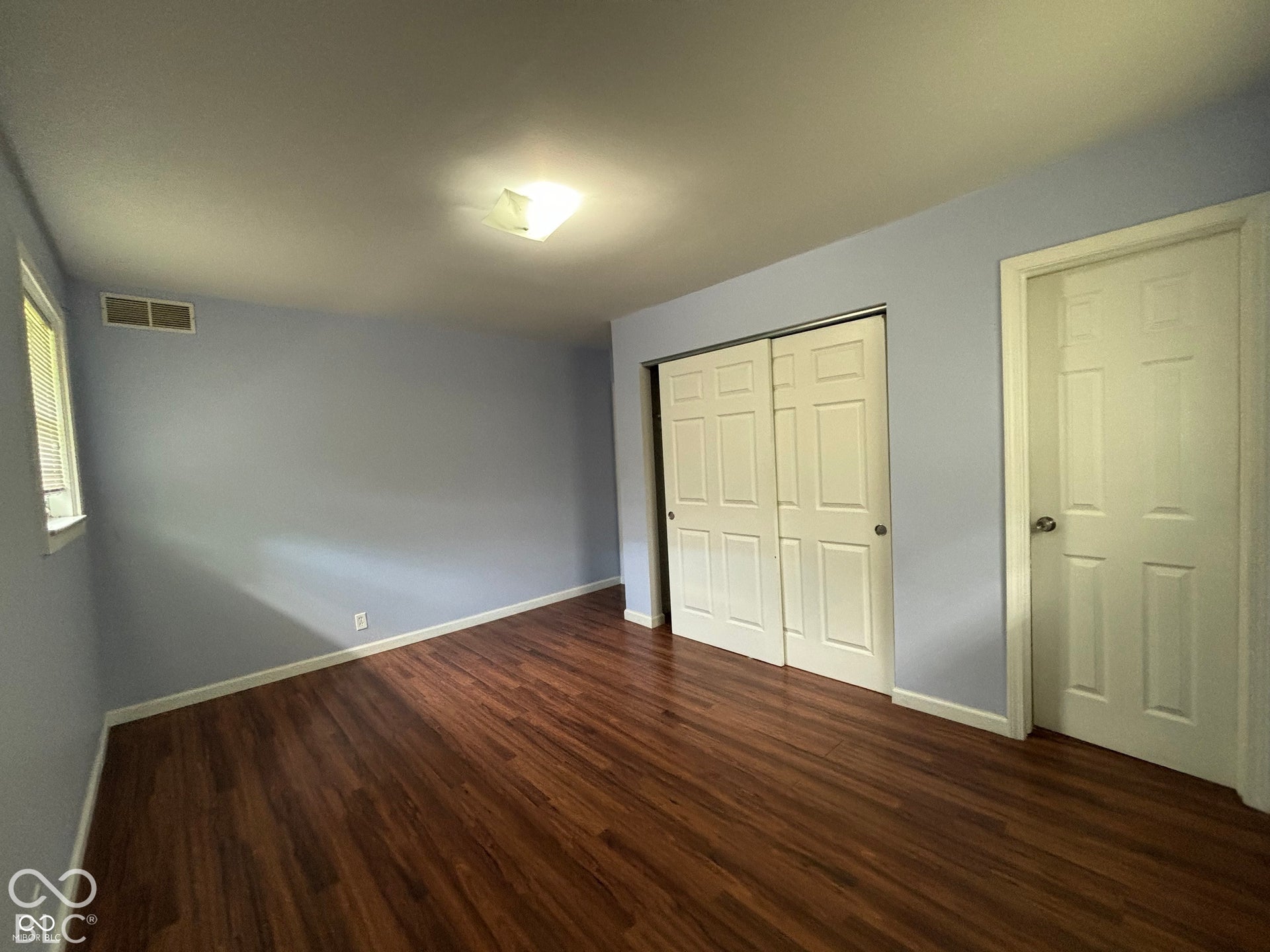 1345 Carroll White Drive, Indianapolis, IN 46219 Wood-finish flooring with light-toned walls