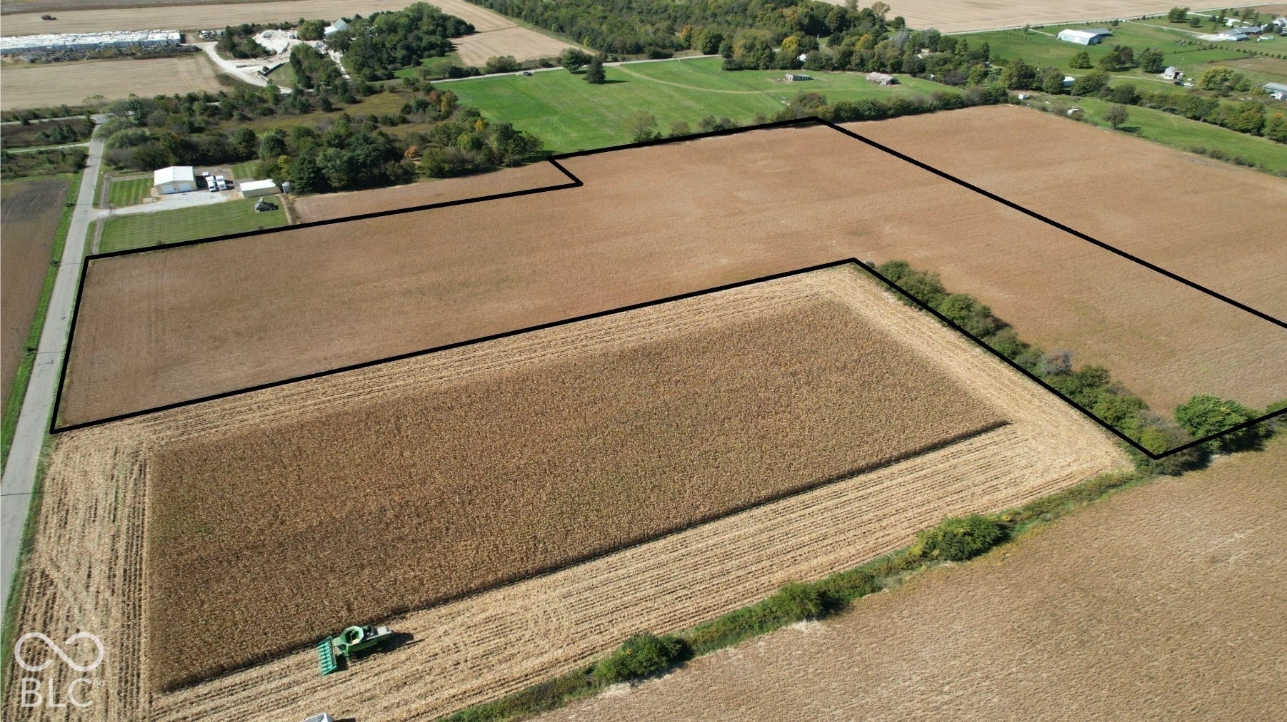 375 W North, Anderson, IN 46012 Expansive agricultural land featuring cultivated fields and a treeline border