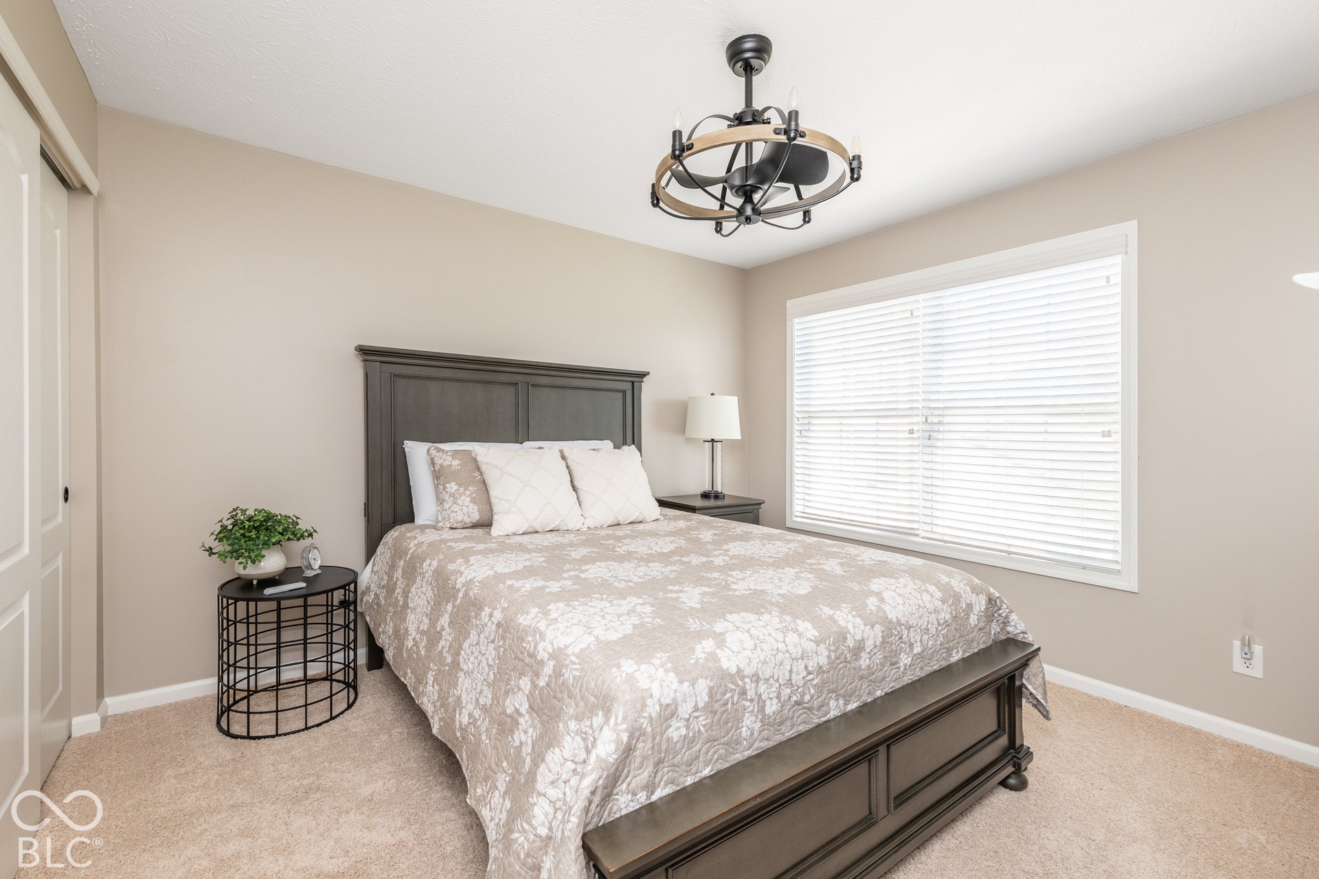 Ceiling fan with a wood-finish accent and matte black hardware
