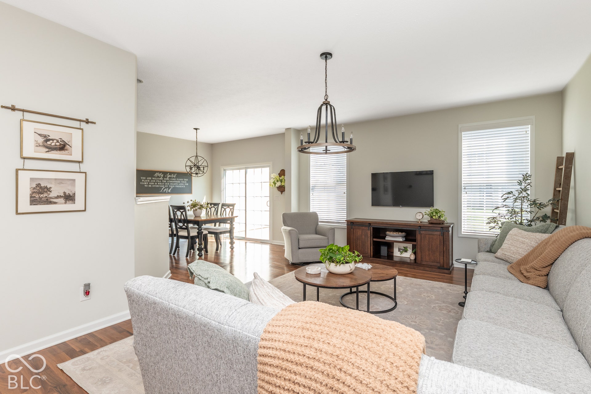 Hardwood-style flooring throughout, with a dining area featuring a sliding glass door