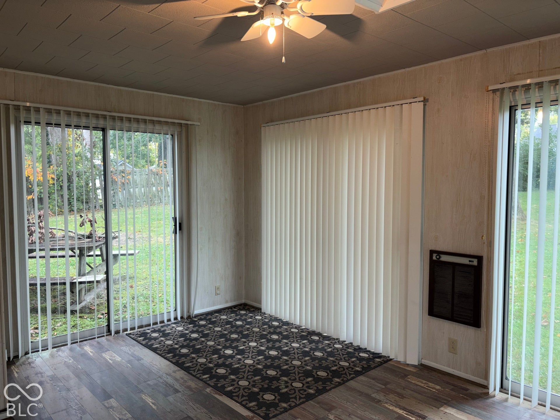 402 E Jackson Street, Farmland, IN 47340 Wood-finish flooring with a ceiling fan overhead