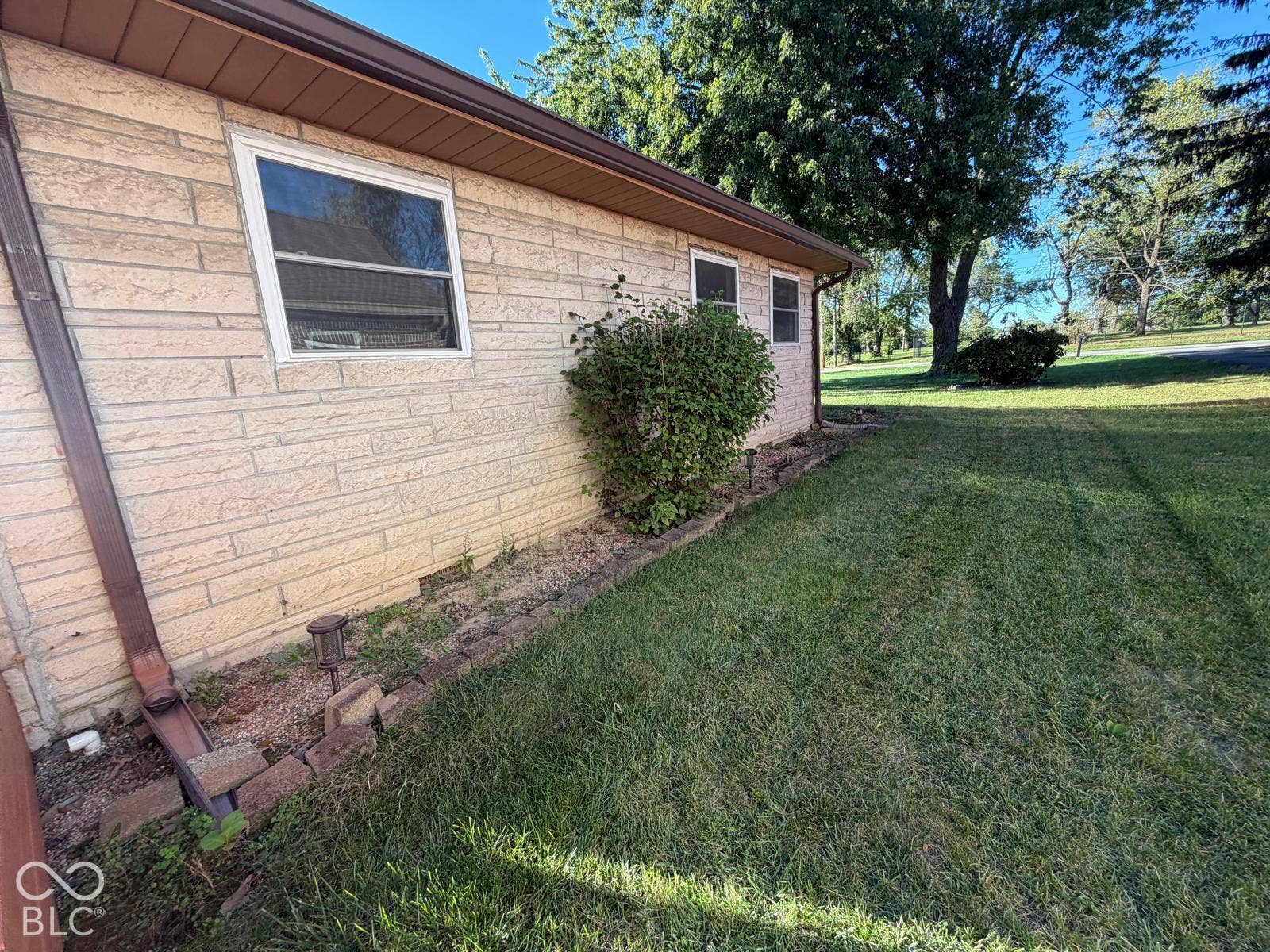 2819 E Edgewood Avenue, Indianapolis, IN 46227 Light-colored brick exterior with white-framed windows