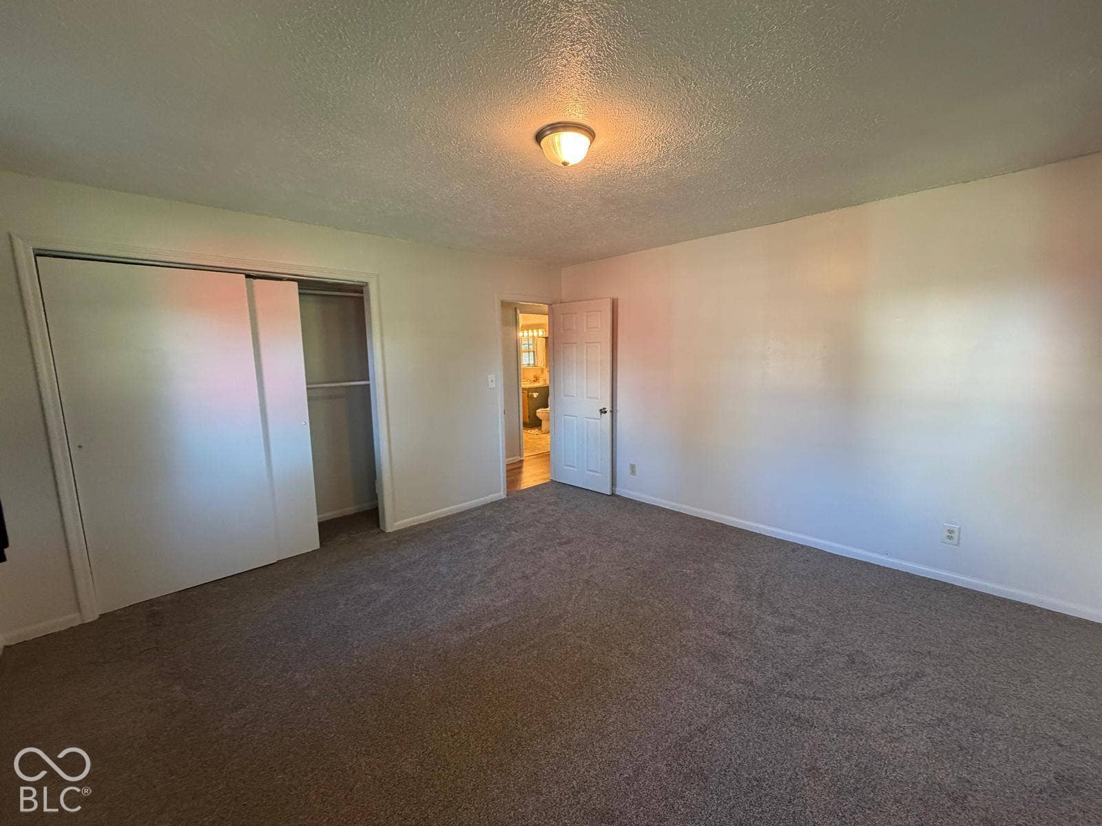 2819 E Edgewood Avenue, Indianapolis, IN 46227 Wall-to-wall carpeting with light-colored walls and a ceiling-mounted light fixture
