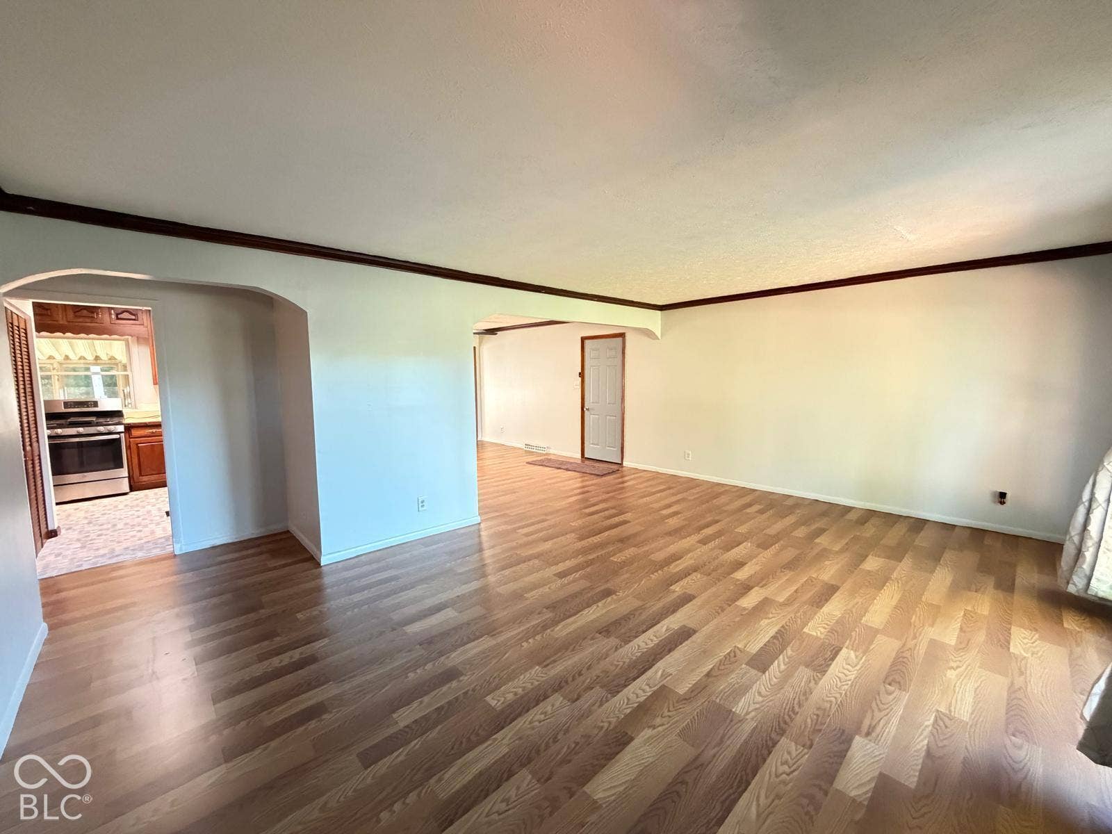 2819 E Edgewood Avenue, Indianapolis, IN 46227 Wood-finish flooring throughout, light-colored walls, and crown molding