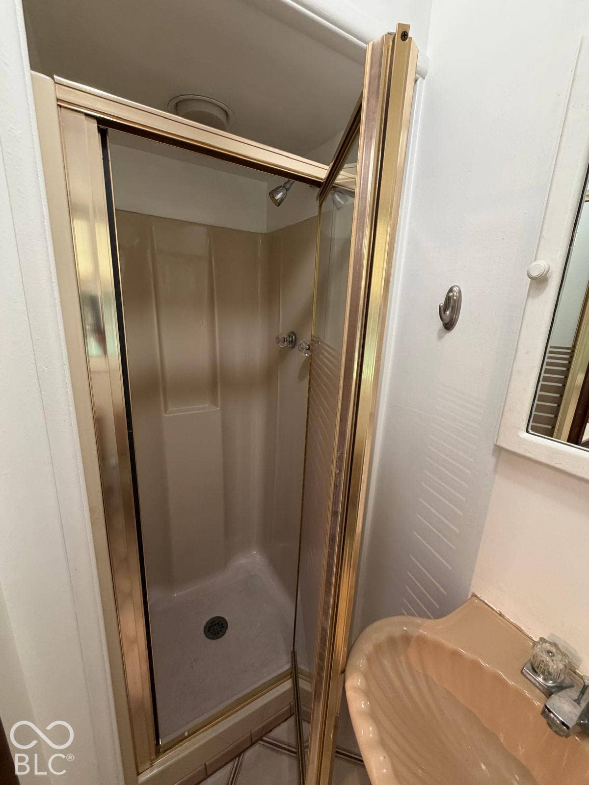 2819 E Edgewood Avenue, Indianapolis, IN 46227 Walk-in shower enclosure with a gold-tone frame