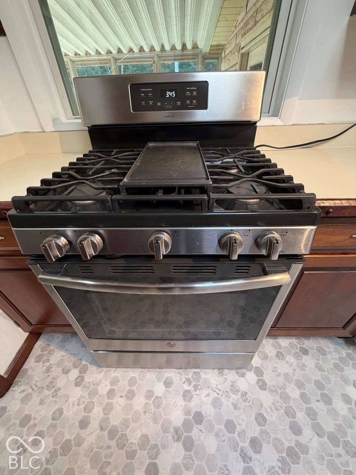 2819 E Edgewood Avenue, Indianapolis, IN 46227 Stainless steel range with a built-in griddle, gas cooktop, and an integrated oven